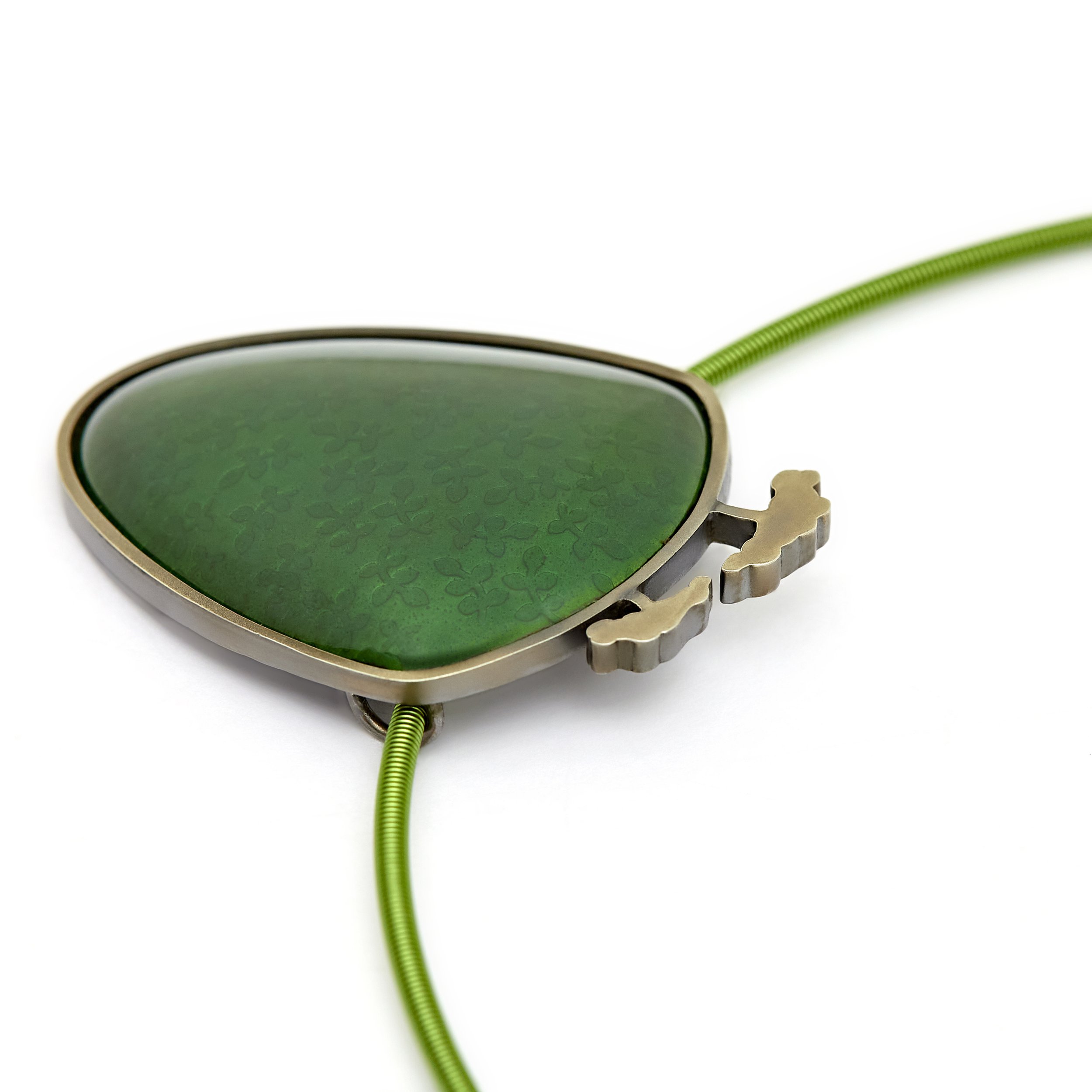 Green sheild pendant with tree tops.jpg