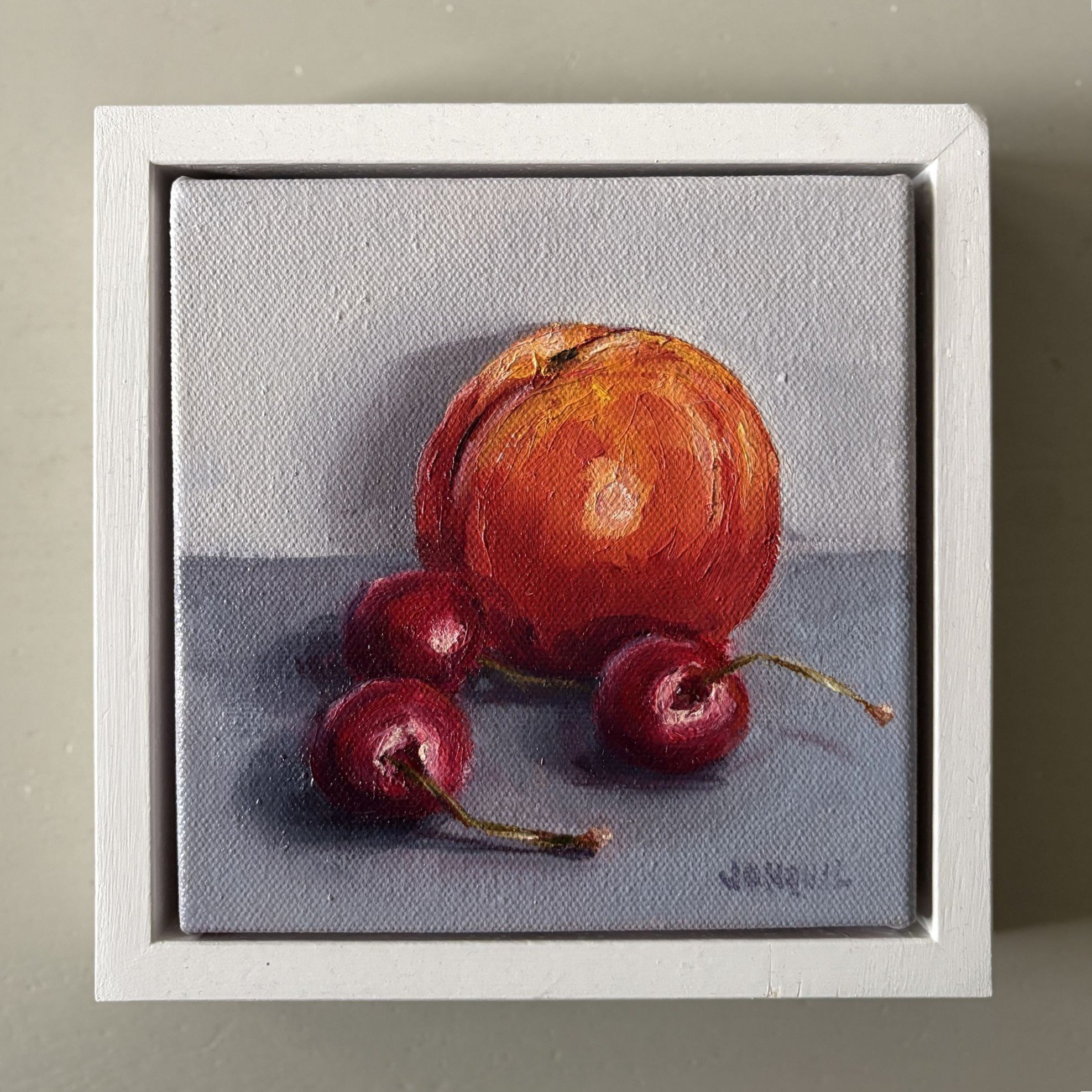 Mini oil painting of cherries and nectarine, contemporary realist still life