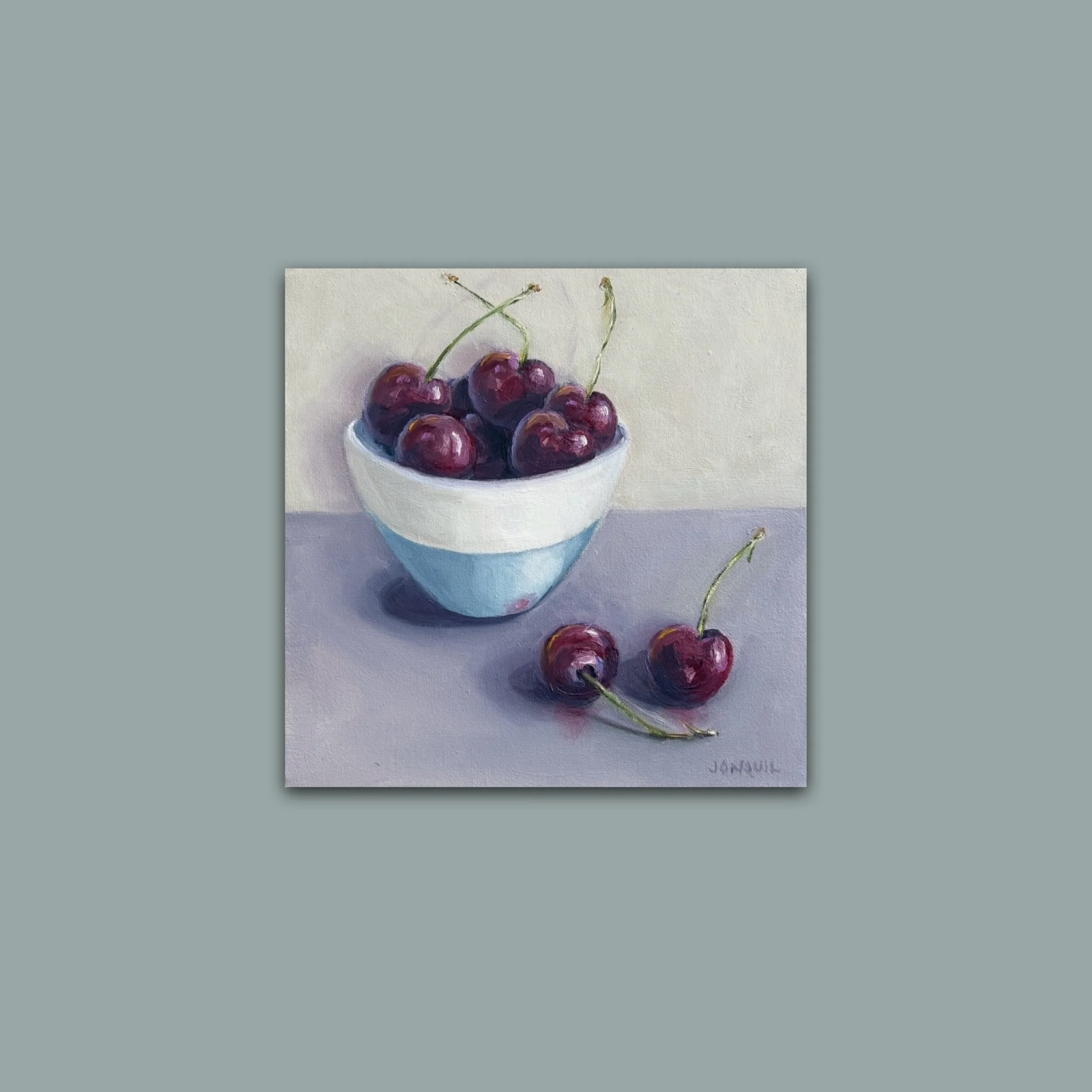 Cherries in a blue & white bowl