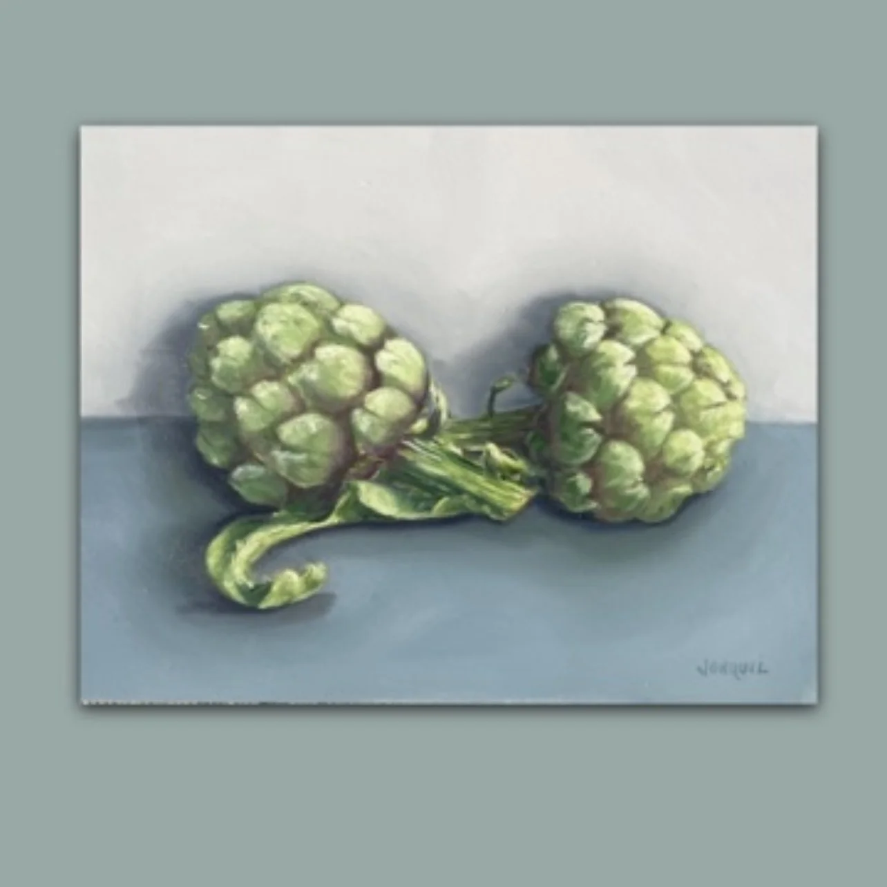 Green and a hint of purple artichokes by British still life artist Jonquil Williamson