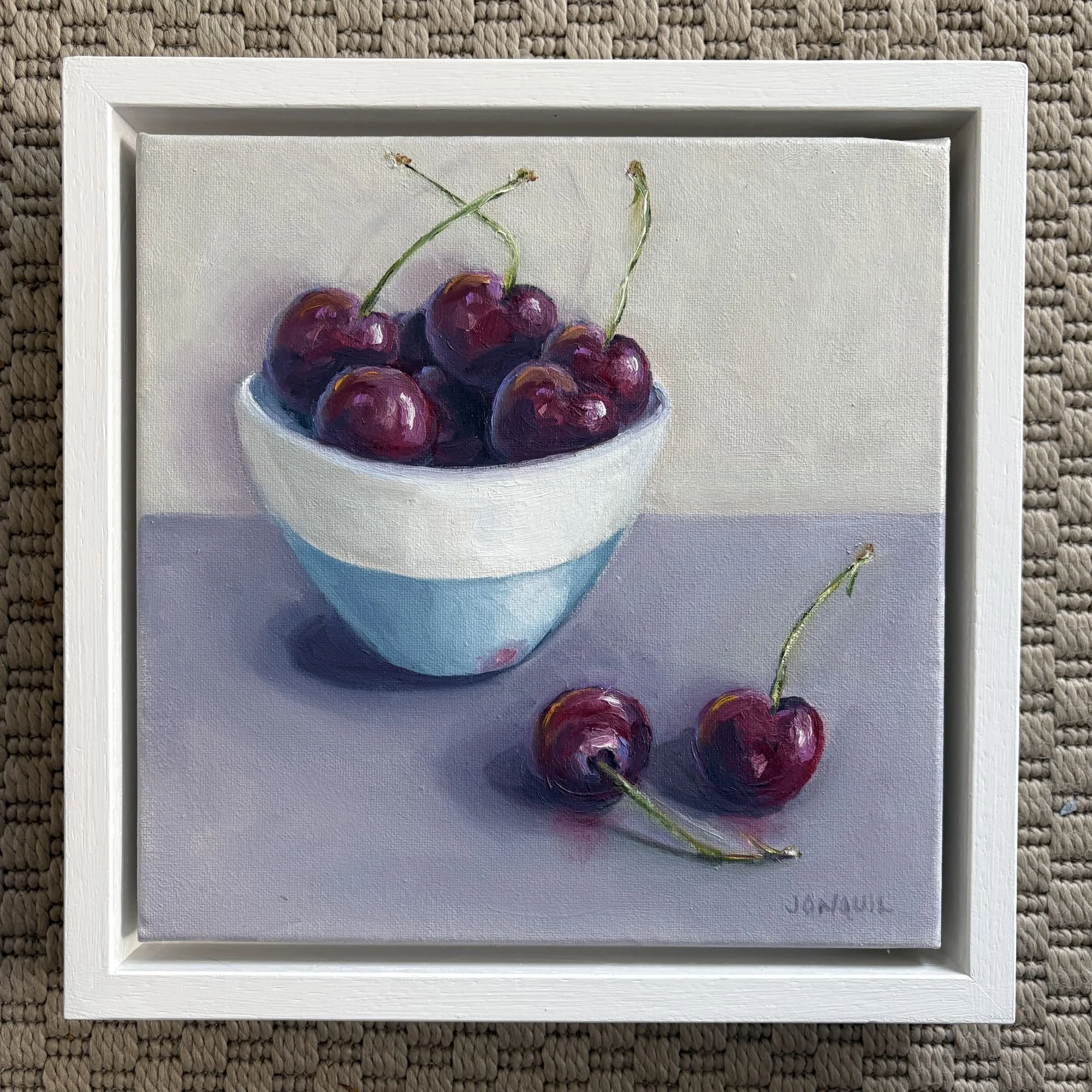 Red cherries in a blue bowl, 24x24cm contemporary realist oil painting on canvas by still life artist Jonquil Williamson.JPG