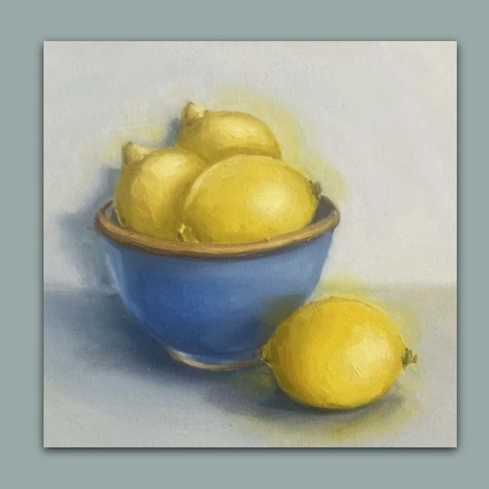 Still life oil painting of lemons in a blue bowl by British artist Jonquil Williamson