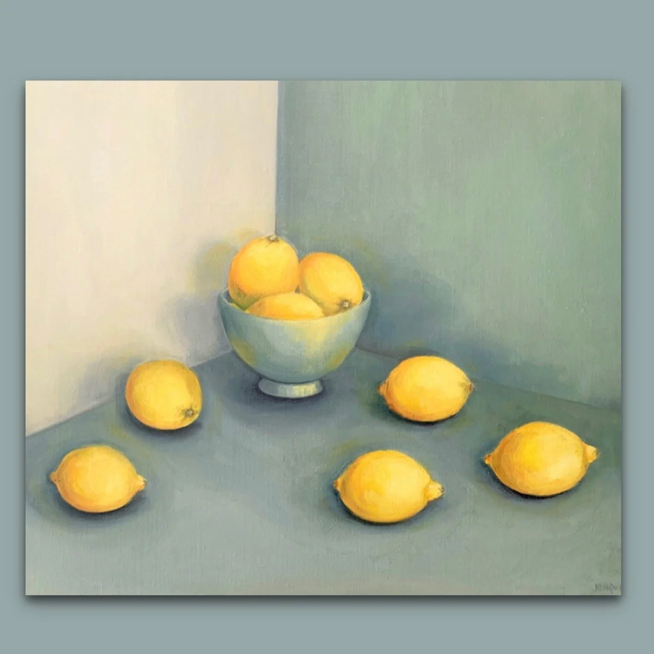Lemons in a bowl and scattered by British still life artist Jonquil Williamson