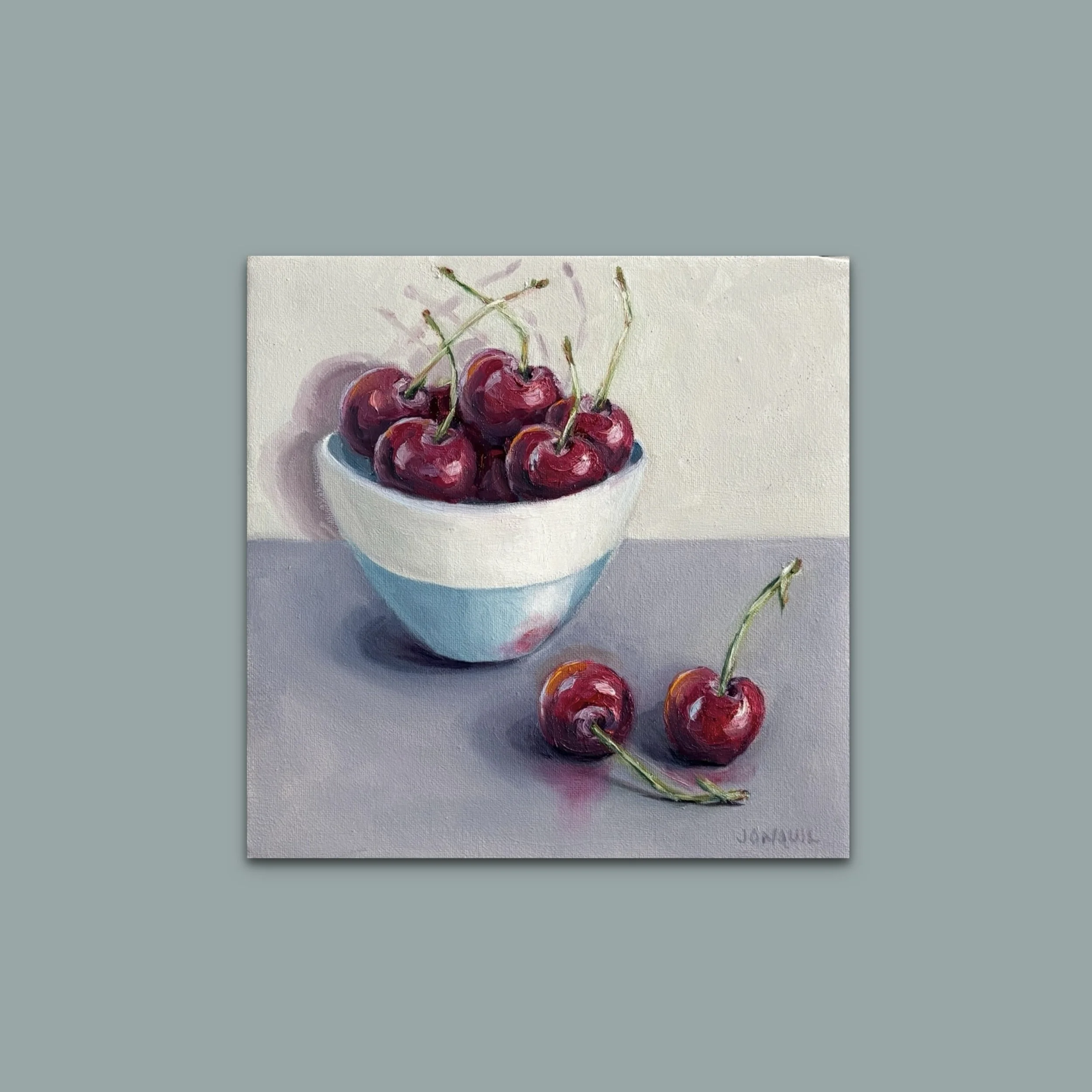 Cherries in a blue & white bowl