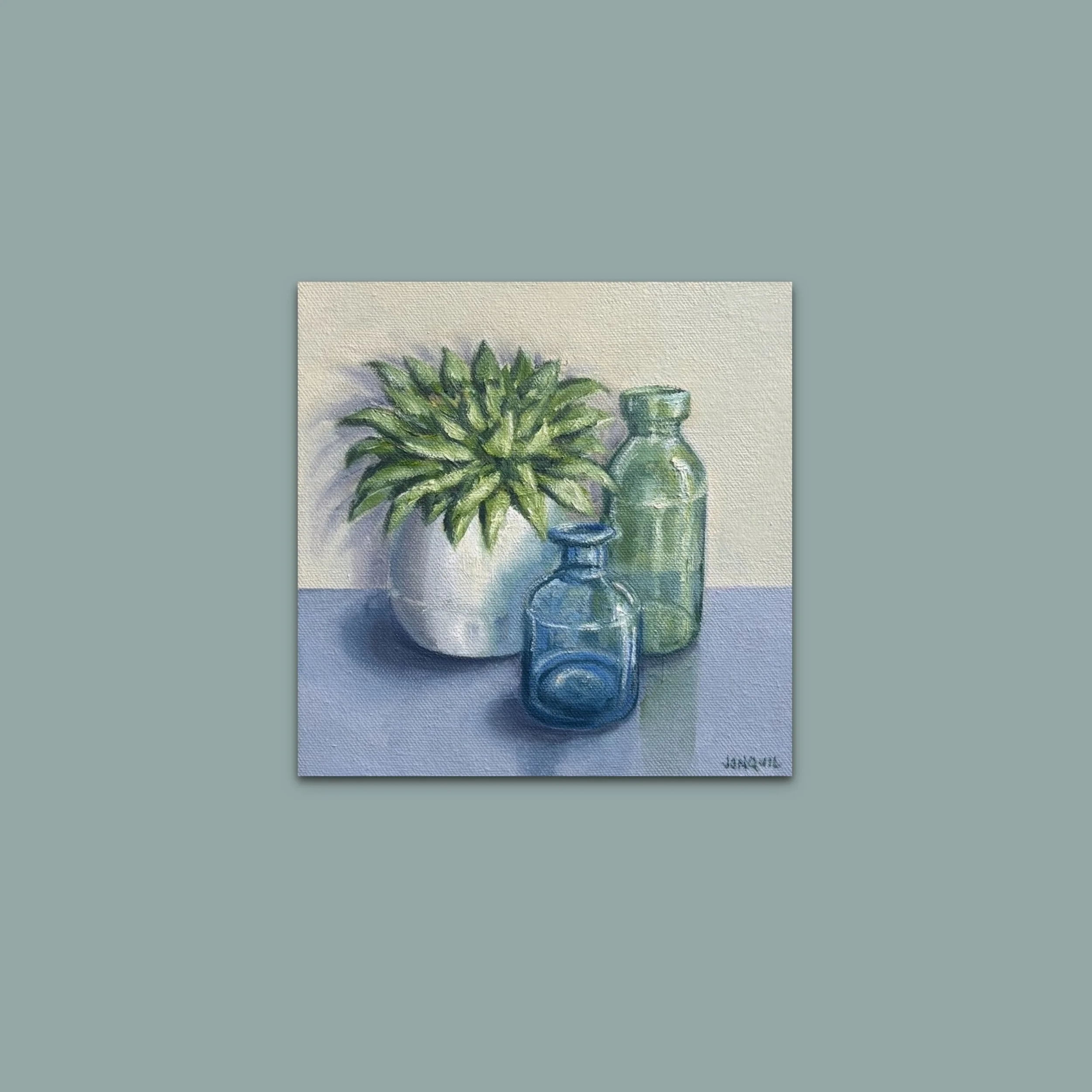 Succulent with Blue & Green Glass Bottles