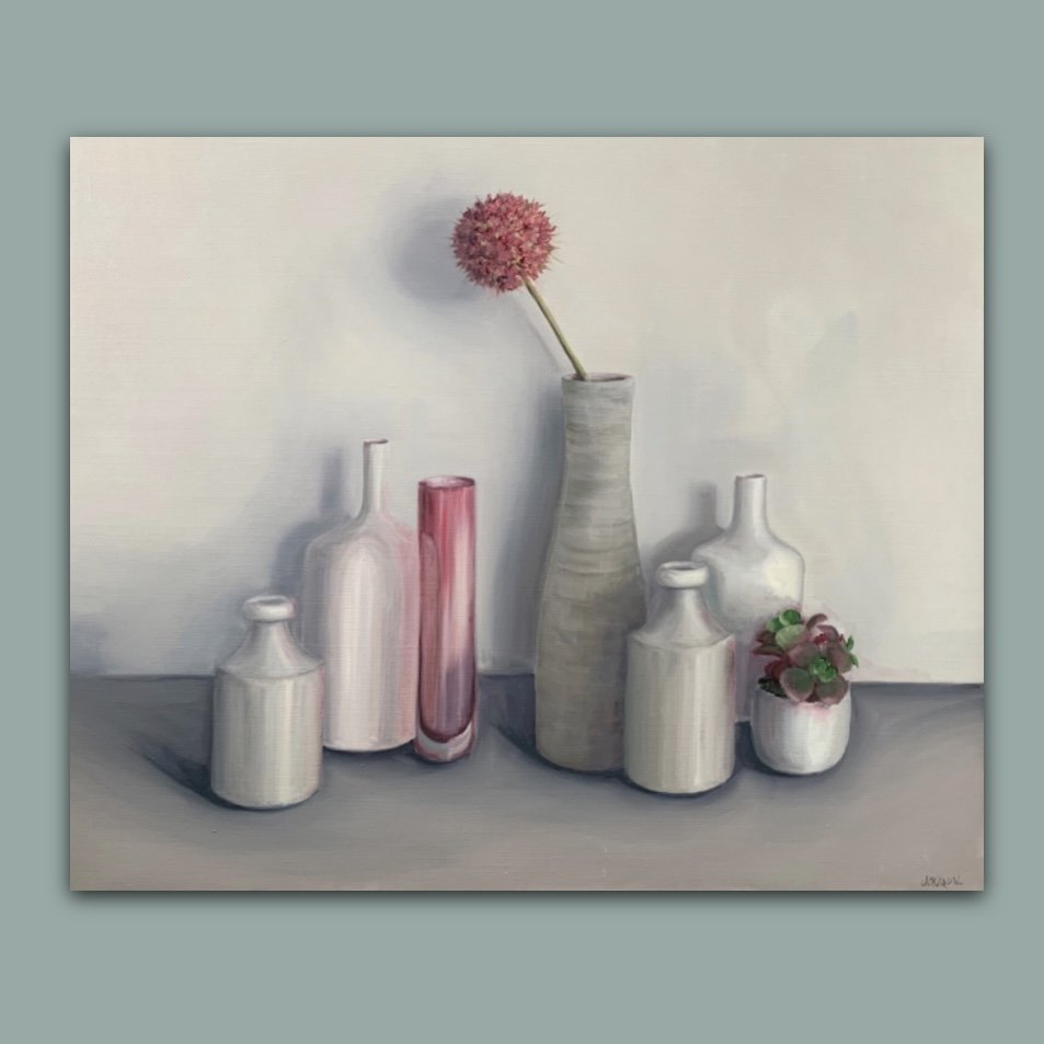 A pink allium amongst pale pots and vases by British still life artist Jonquil Williamson