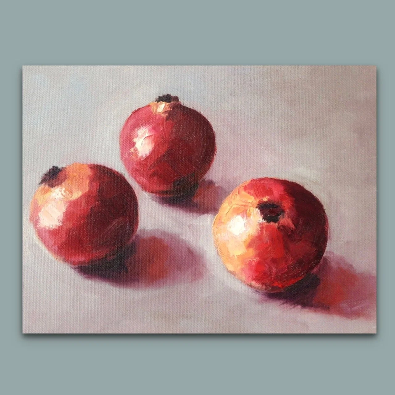 Colourful still life oil painting of POMEGRANATES in a blue bowl by British artist Jonquil Williamson