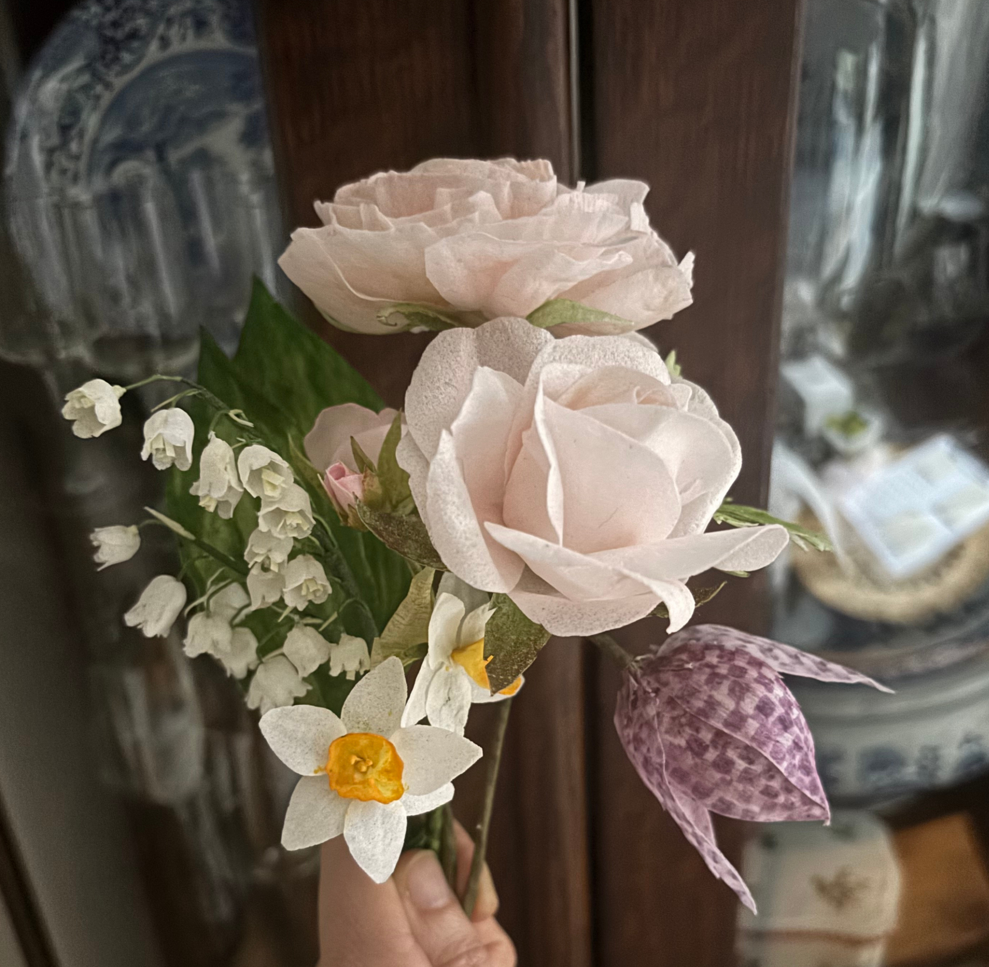 per+tea+rose%2C+lily+of+the+valley%2C+fritillaria%2C+and+narcissus+with+a+wooden+china+cabinet+in+the+background.png