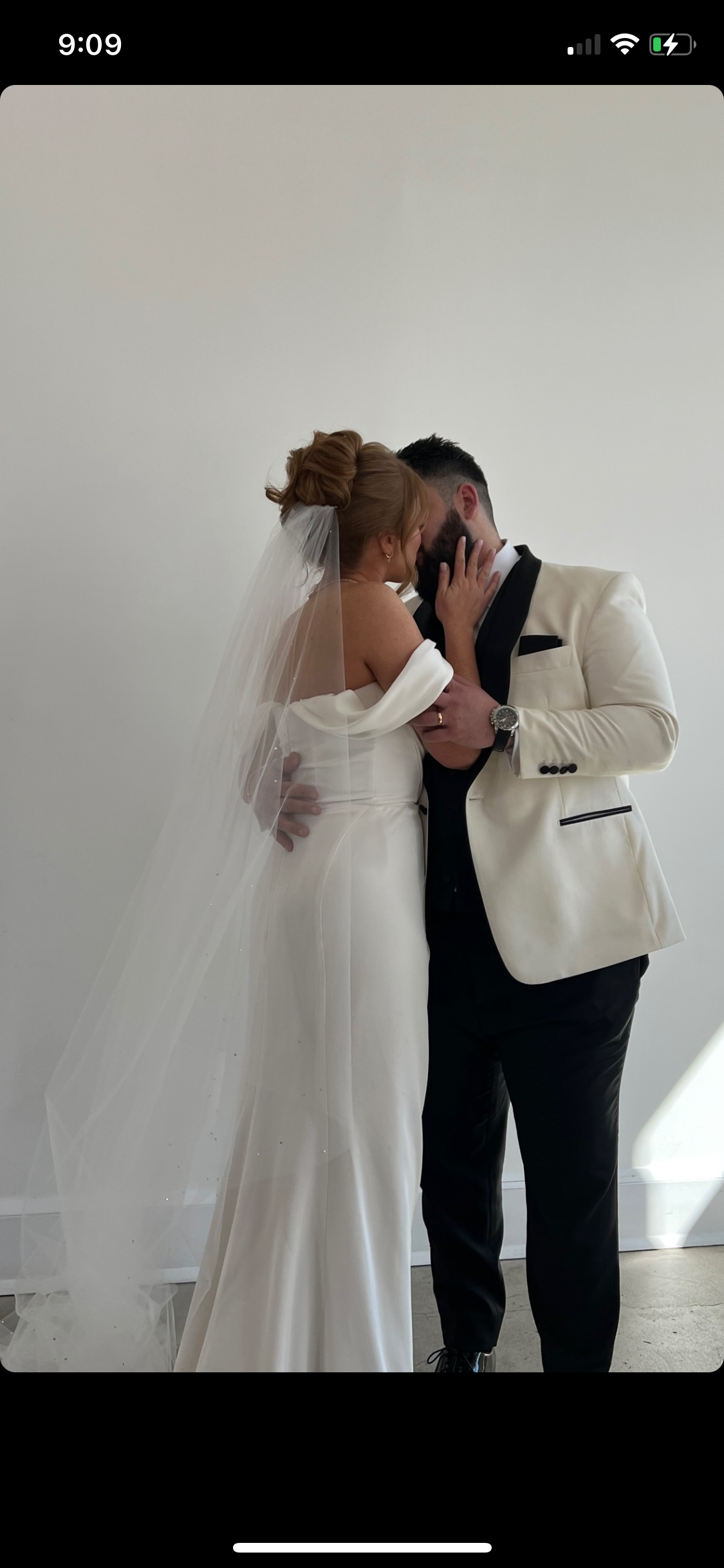 Bride and Groom kissing with a spray tan