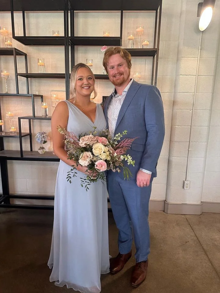 A Bridesmaid and her date with a spray tan