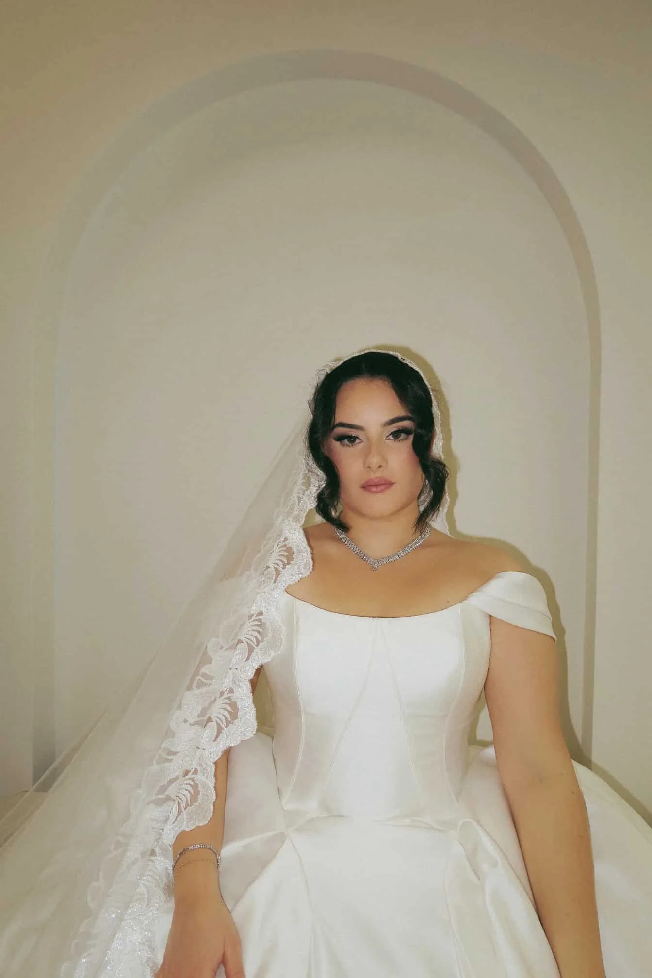 Bride in her wedding dress with a spray tan