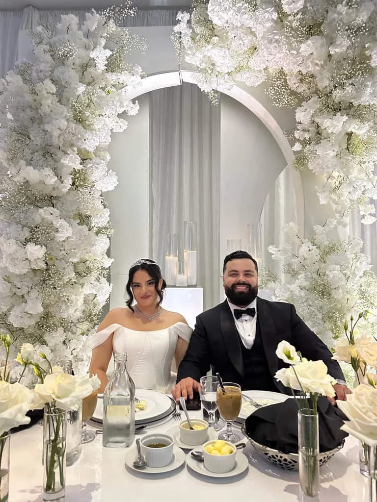 Bride and Groom at head table with a spray tan