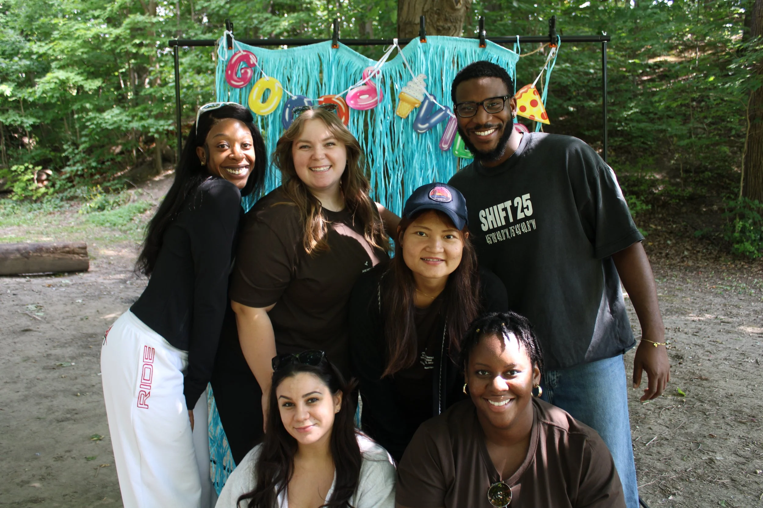 Community Wellbeing team staff smiling in a group photo