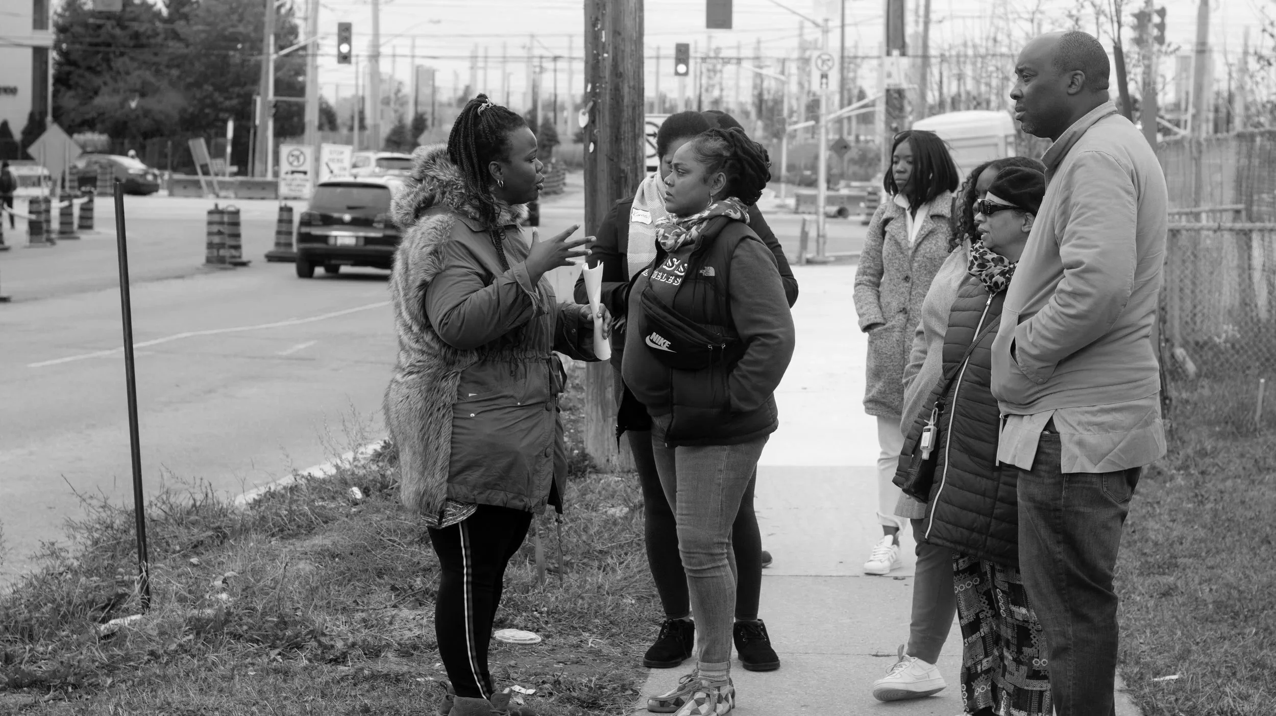 Staff member leading a neighbourhood walking tour in Jane-Finch