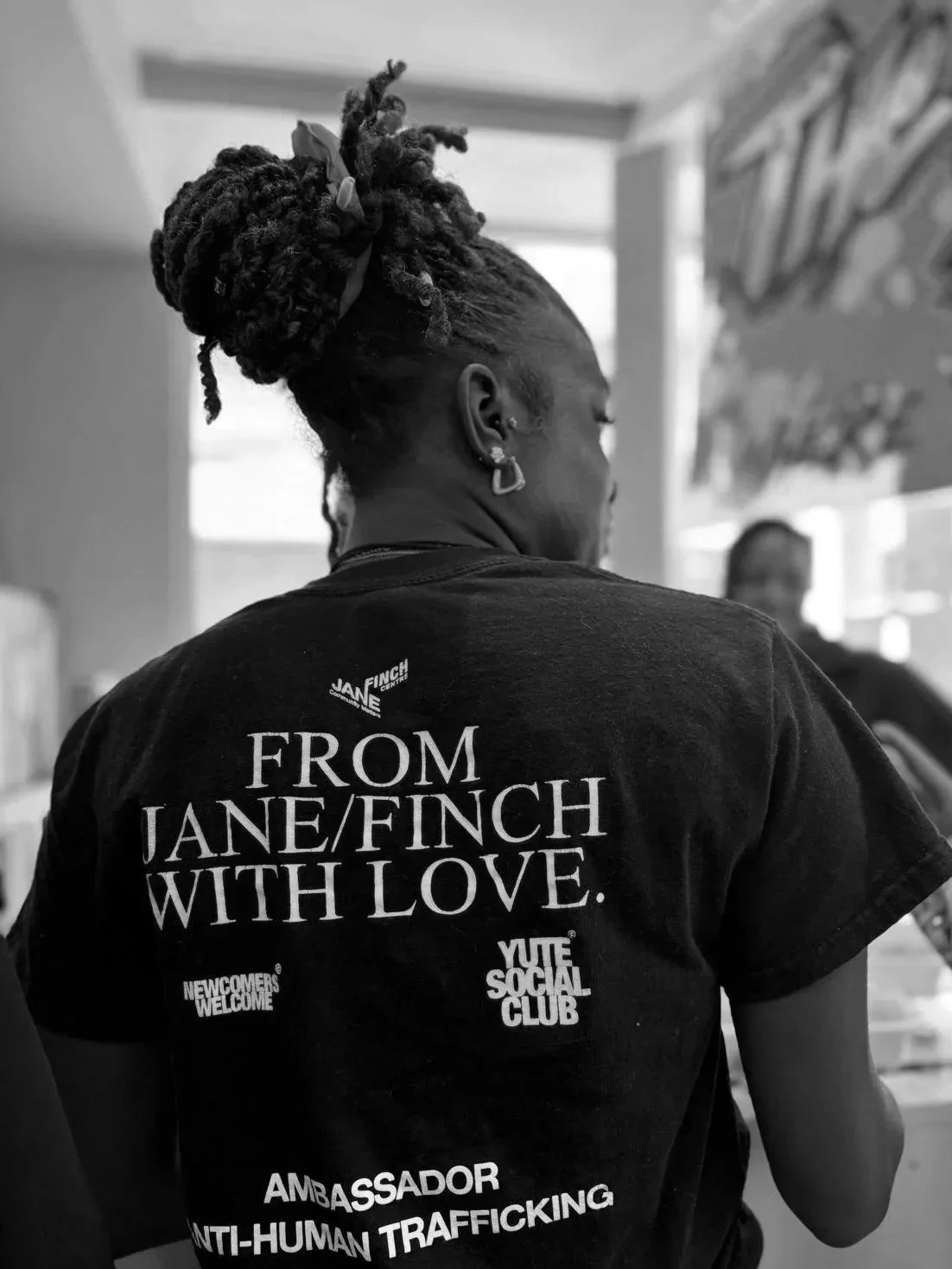 Youth wearing Jane/Finch Centre merchandise stating "From Jane/Finch with Love"