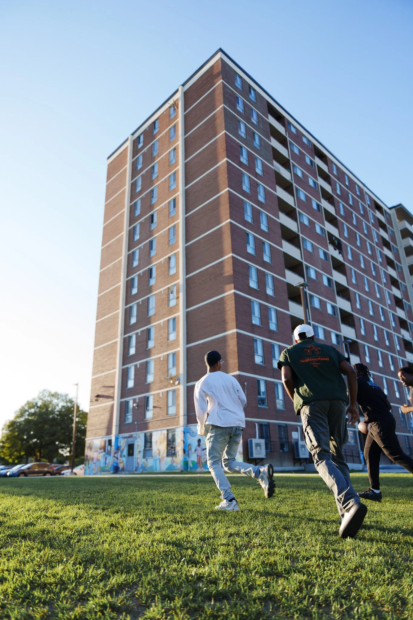 Youth participants playing a game outside the Jane/Finch Centre building