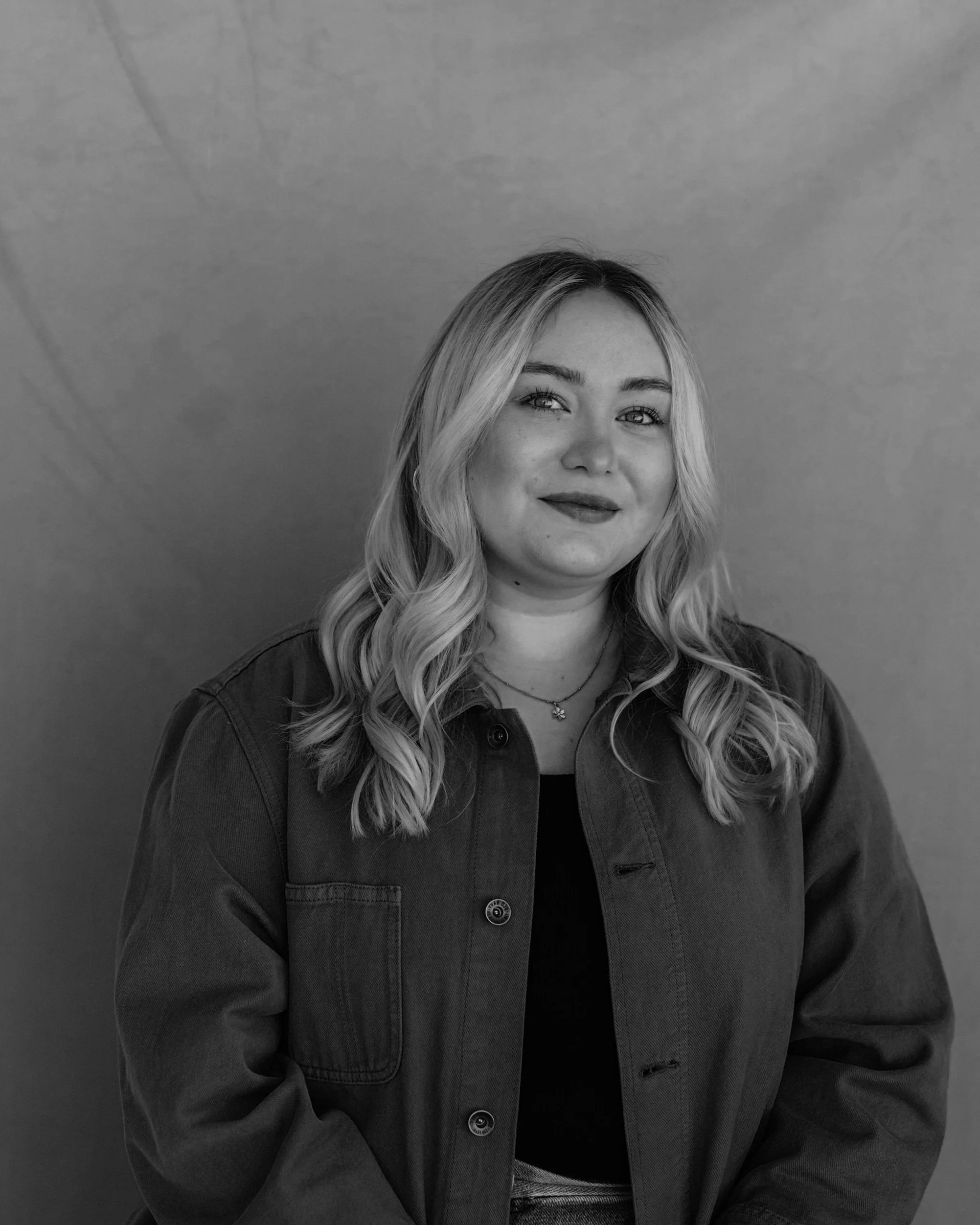 Black and white portrait of Paige Simpson, founder and principal strategist at Yarrow Social.