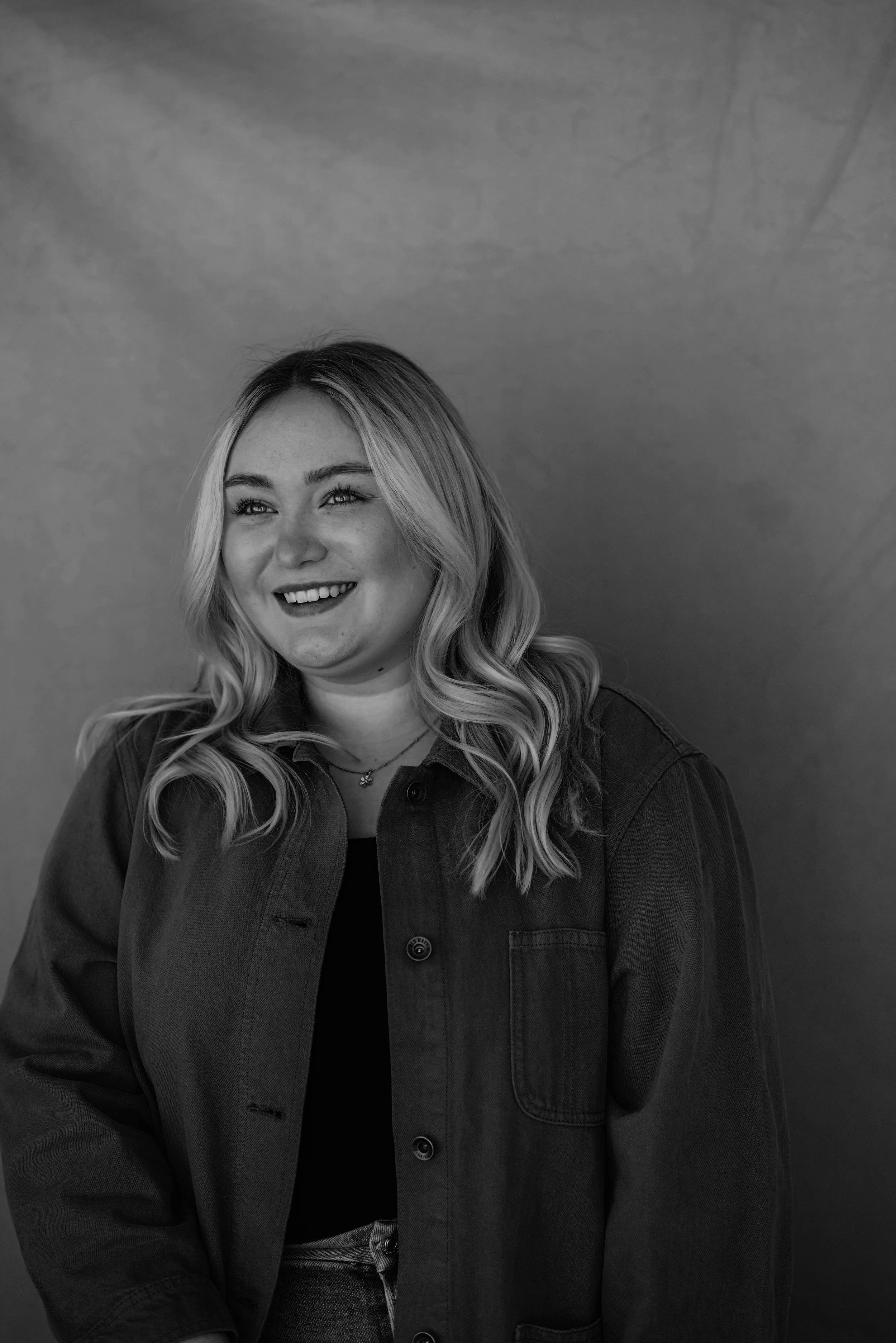 Black and white portrait of Paige Simpson, founder and principal strategist at Yarrow Social.