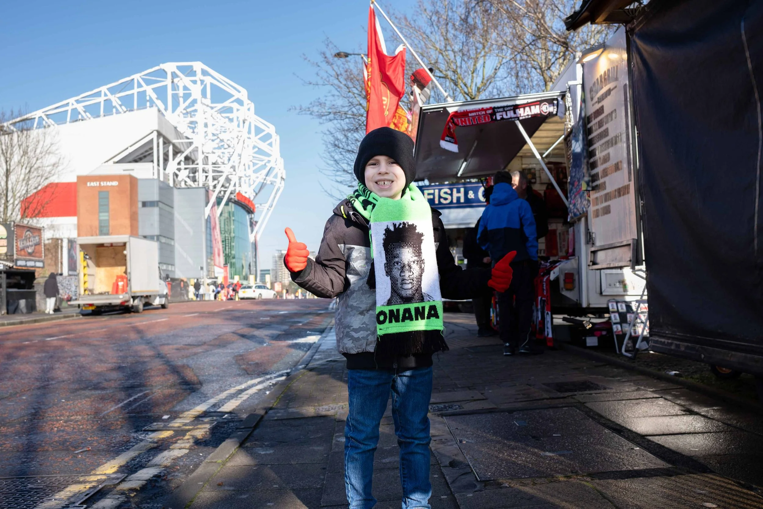 Young Manchester United fan outside Old Trafford