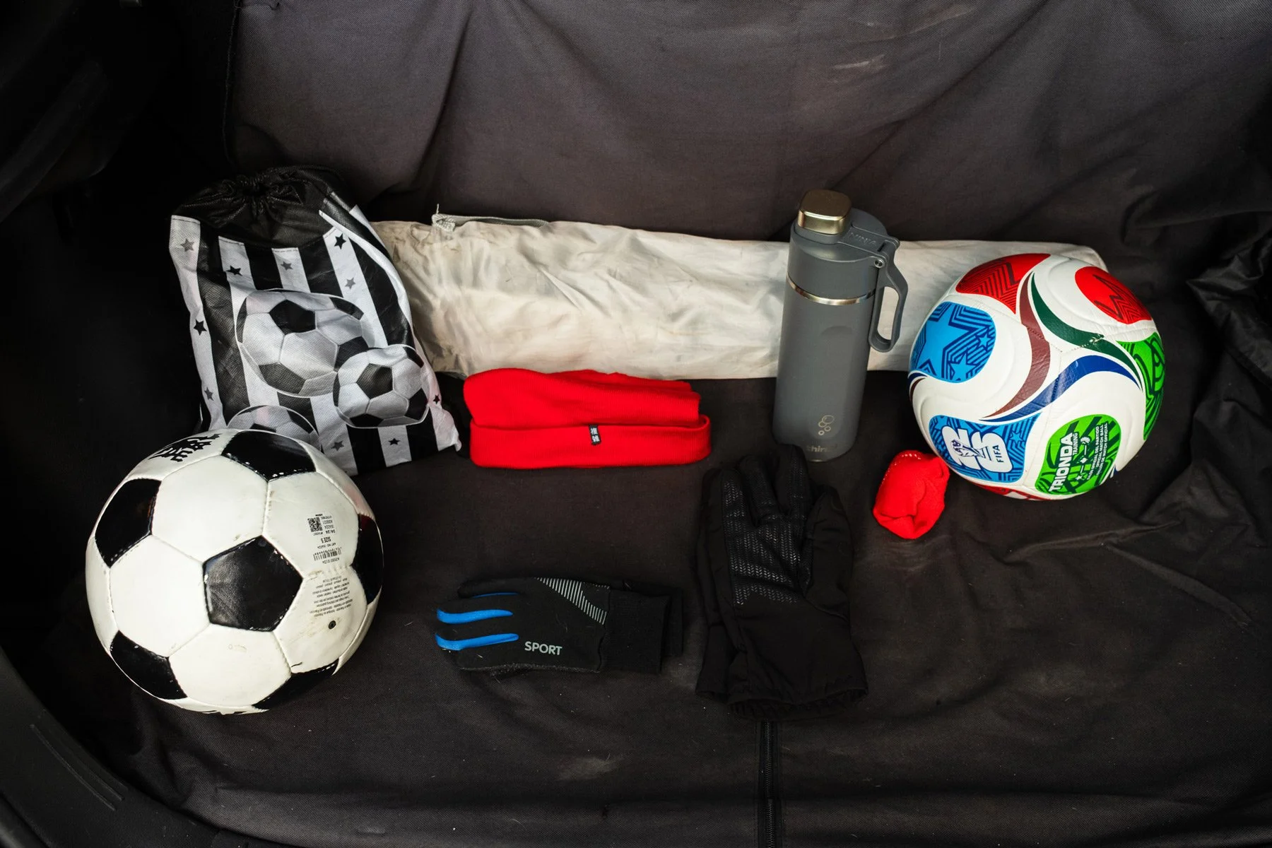 Car boot cover with football items