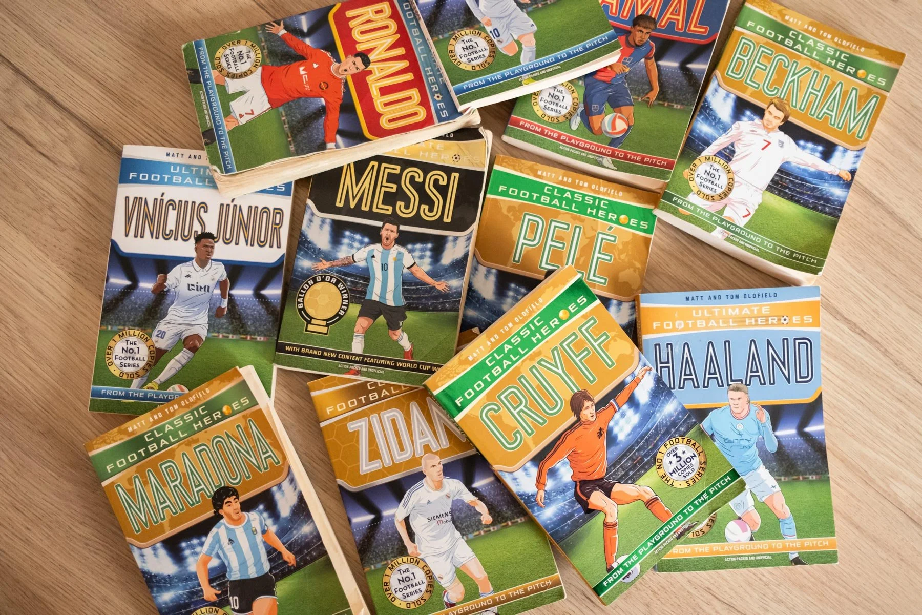 Collection of Football Heroes books laid out on table