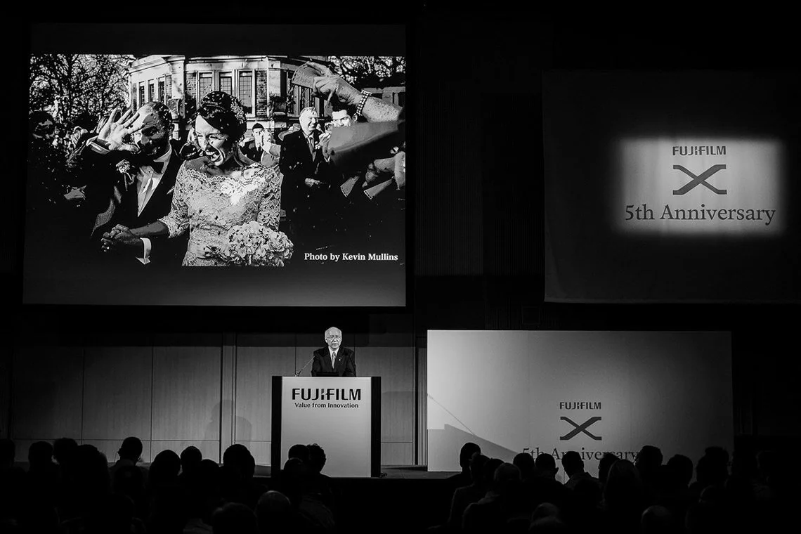 Fujifilm presentation screen showing Kevin Mullins' wedding photography
