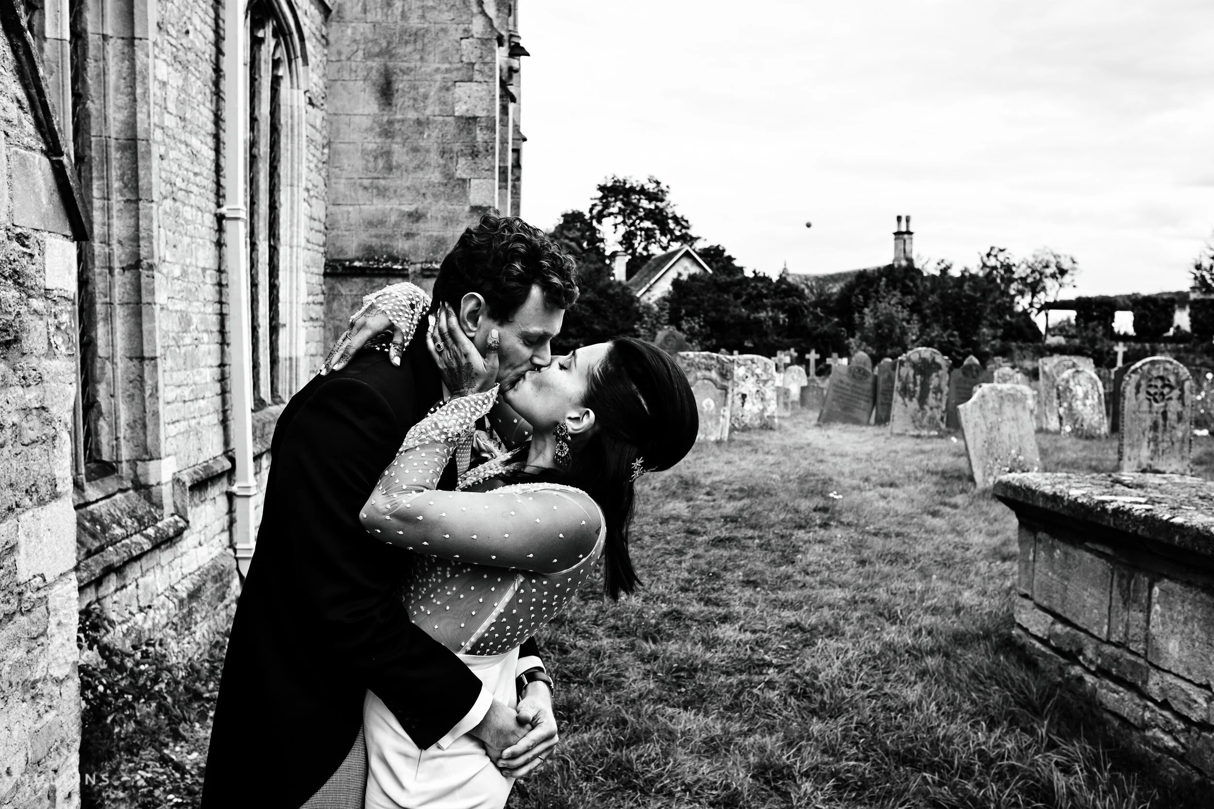 Bride and Groom having a big snog