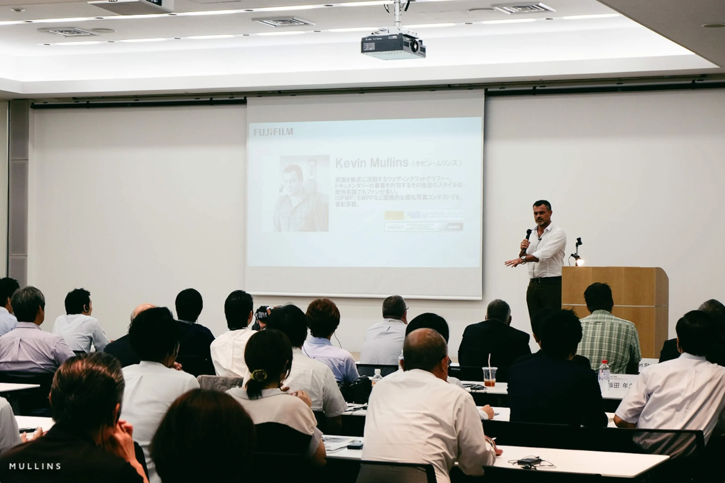 Kevin Mullins on stage presenting to engineers