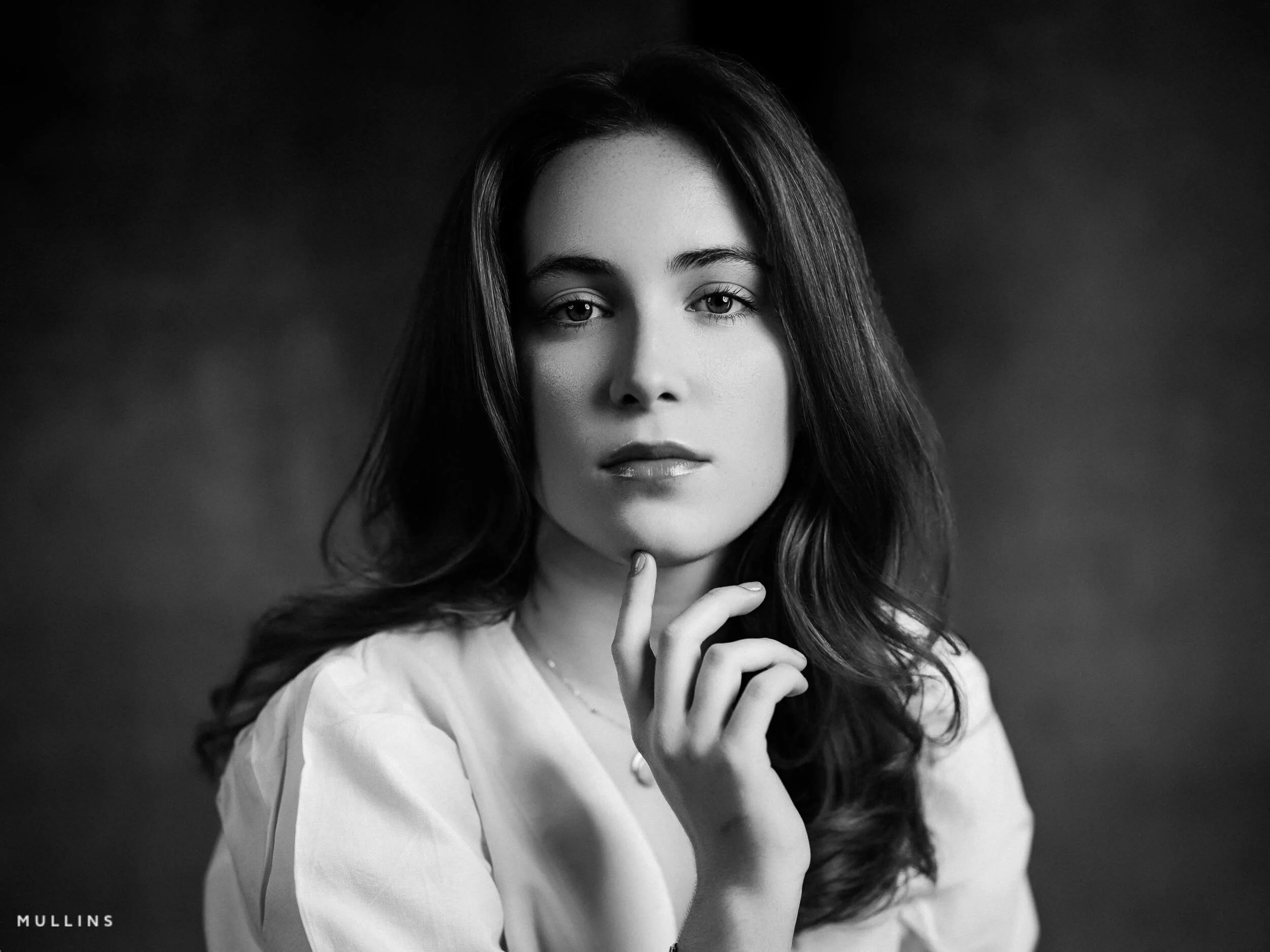 Black and White Actor Headshot of a young woman in a studio.