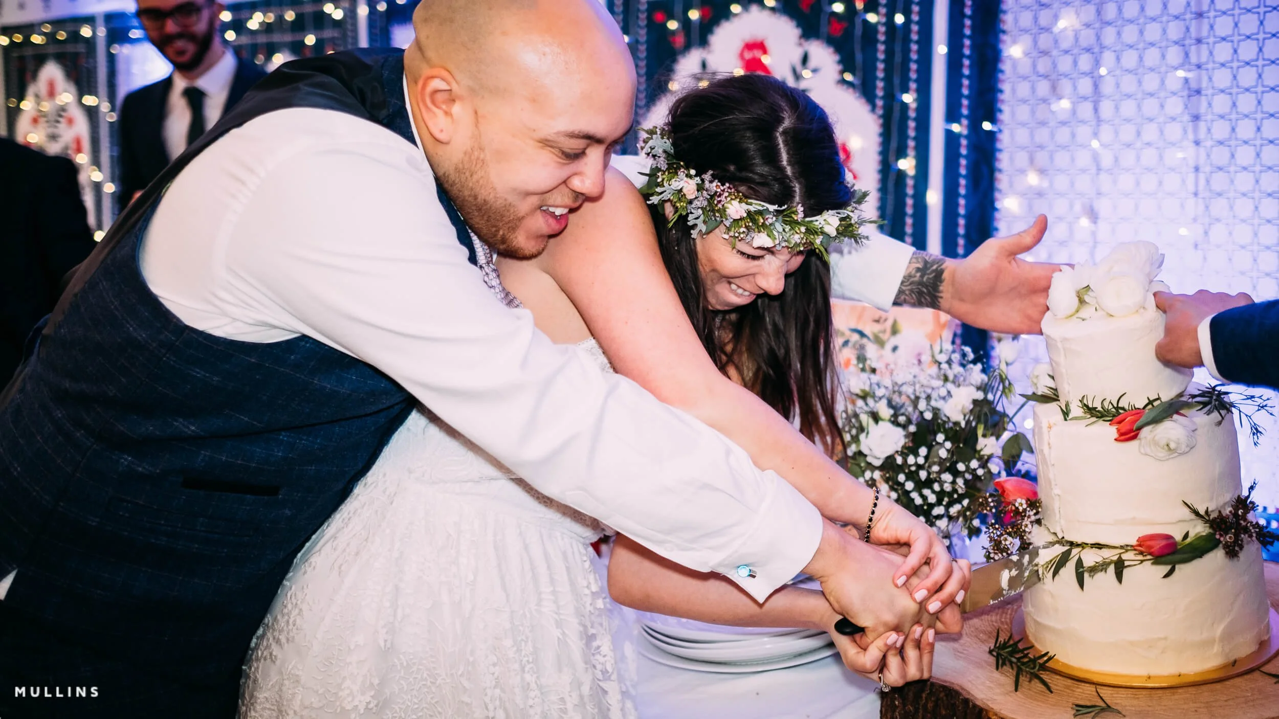 Bride and groom cutting a cake