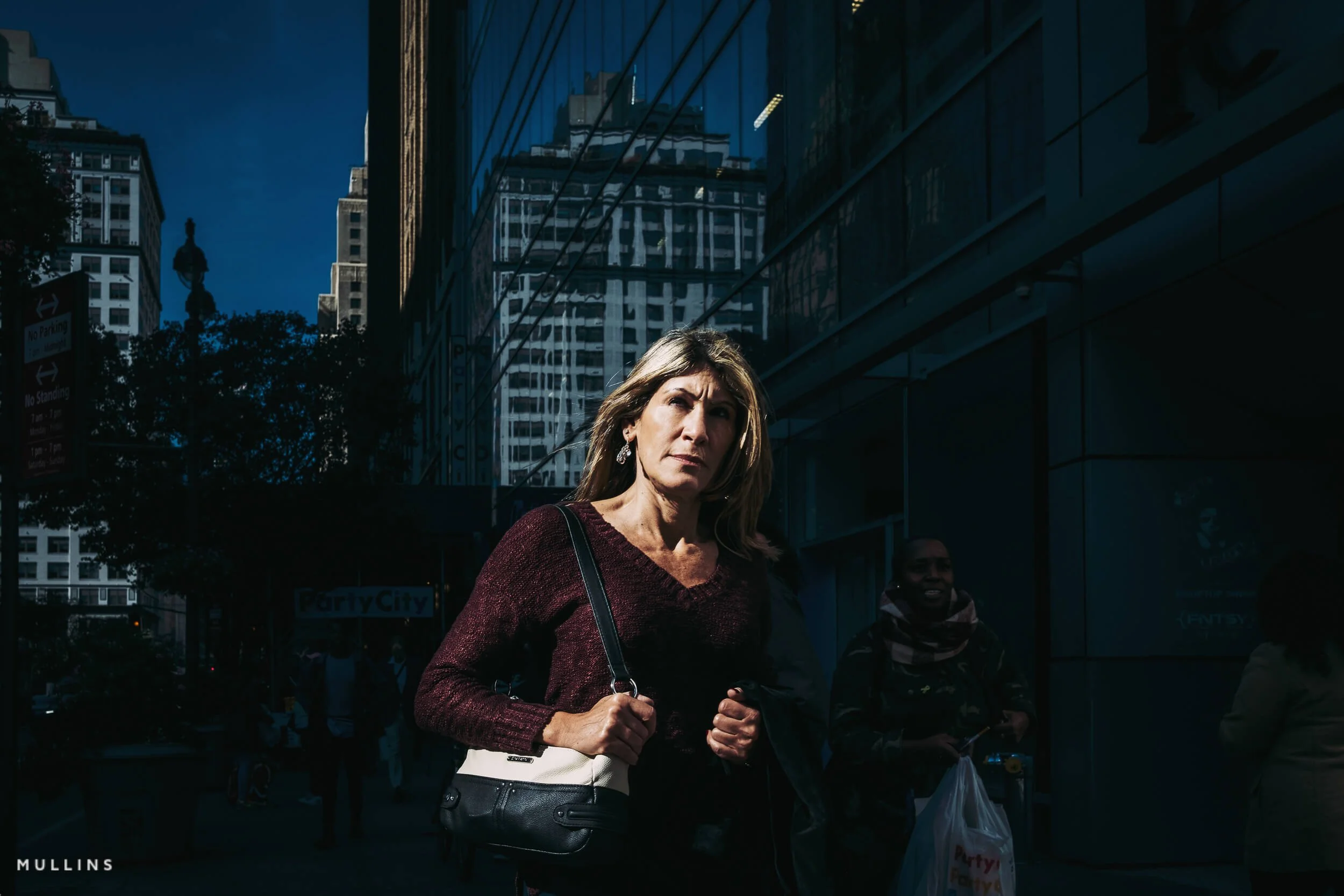 Street photograph showing strong light and shadow