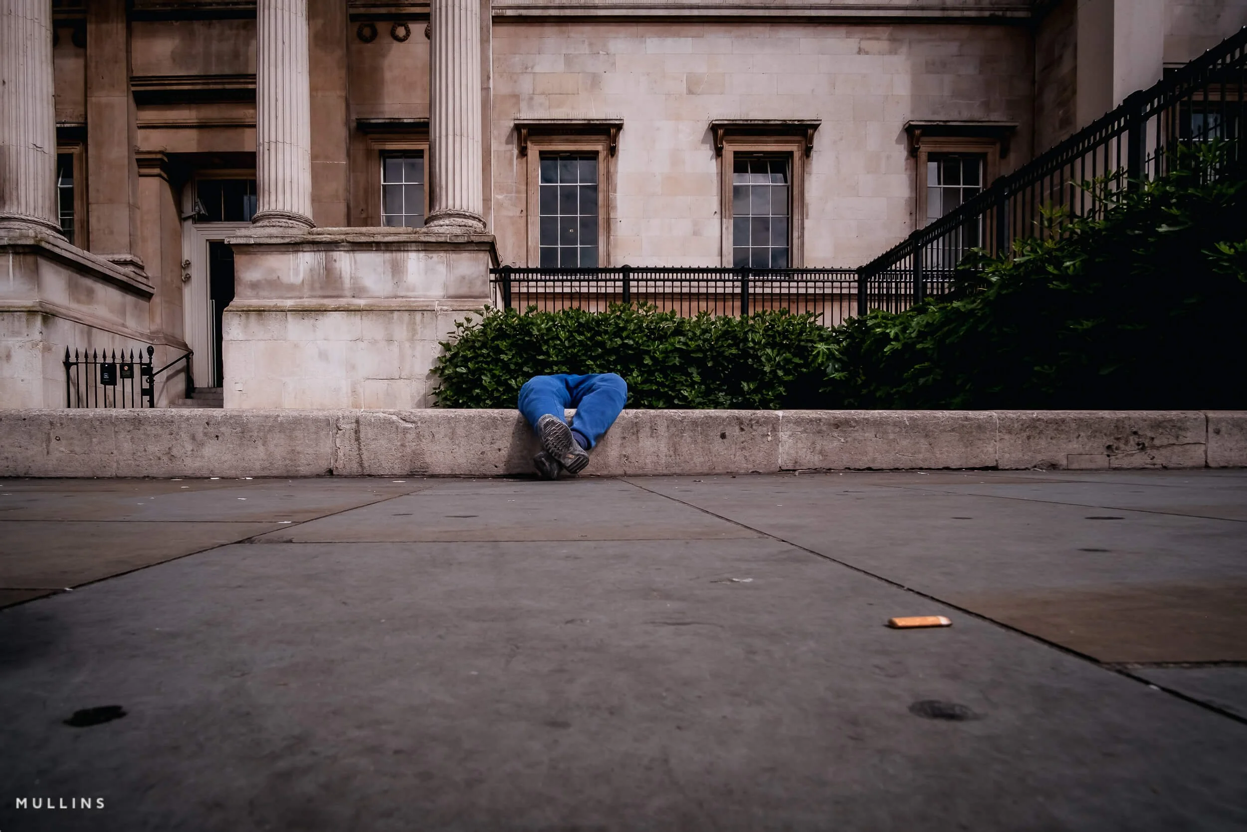 Street photograph showing a quiet human moment