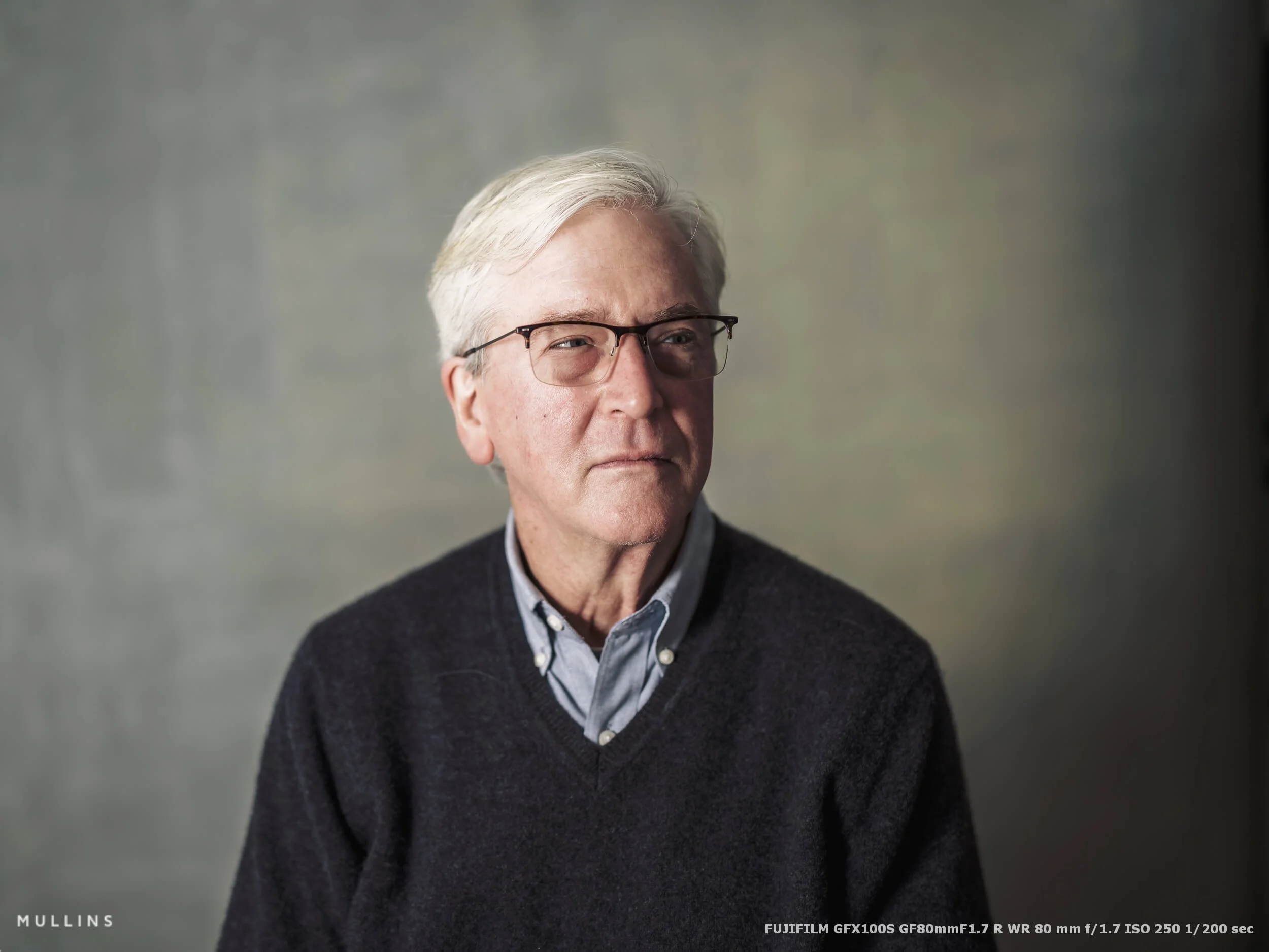A studio portrait of an older gentleman