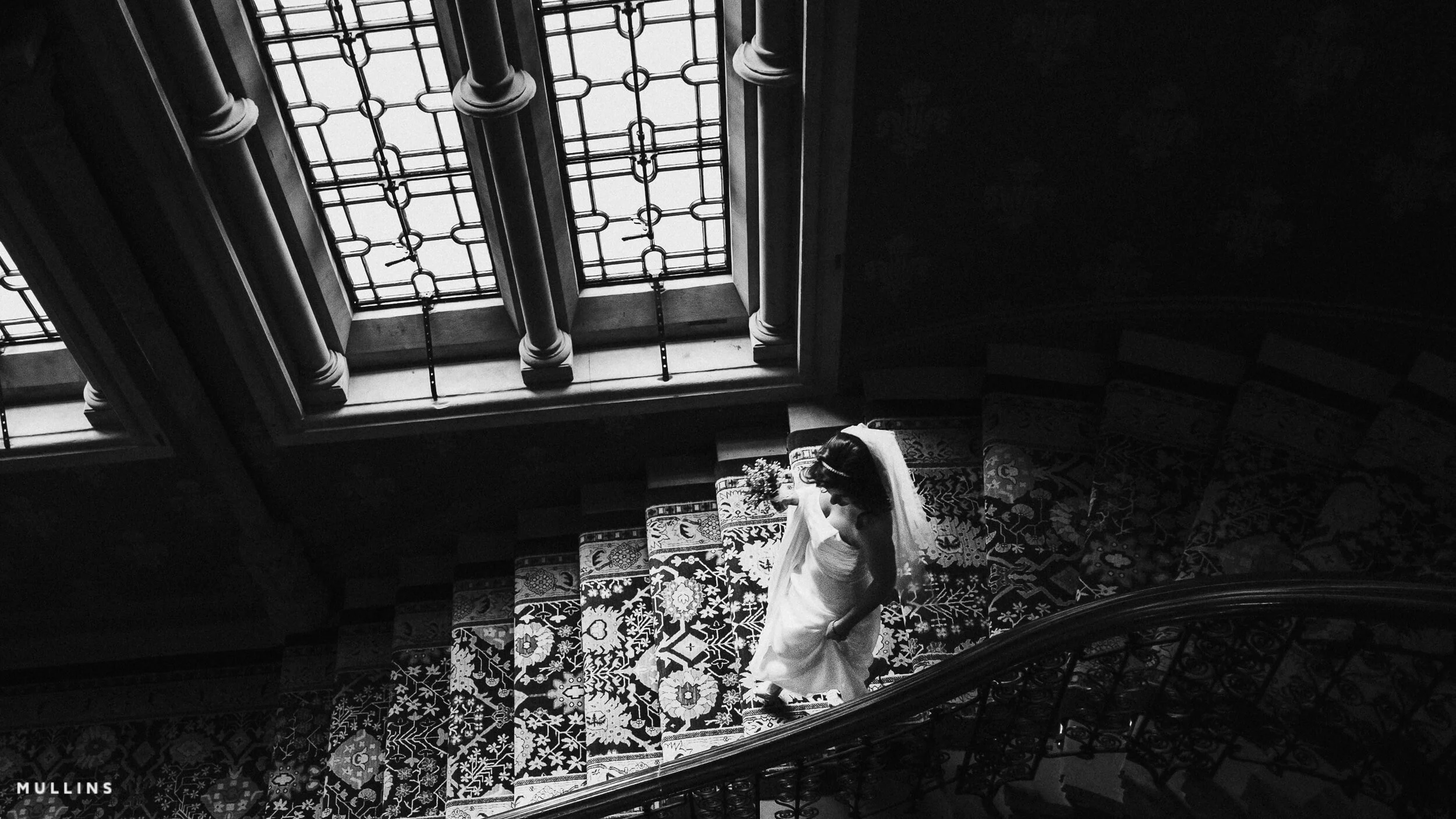 Bride walks down stairs