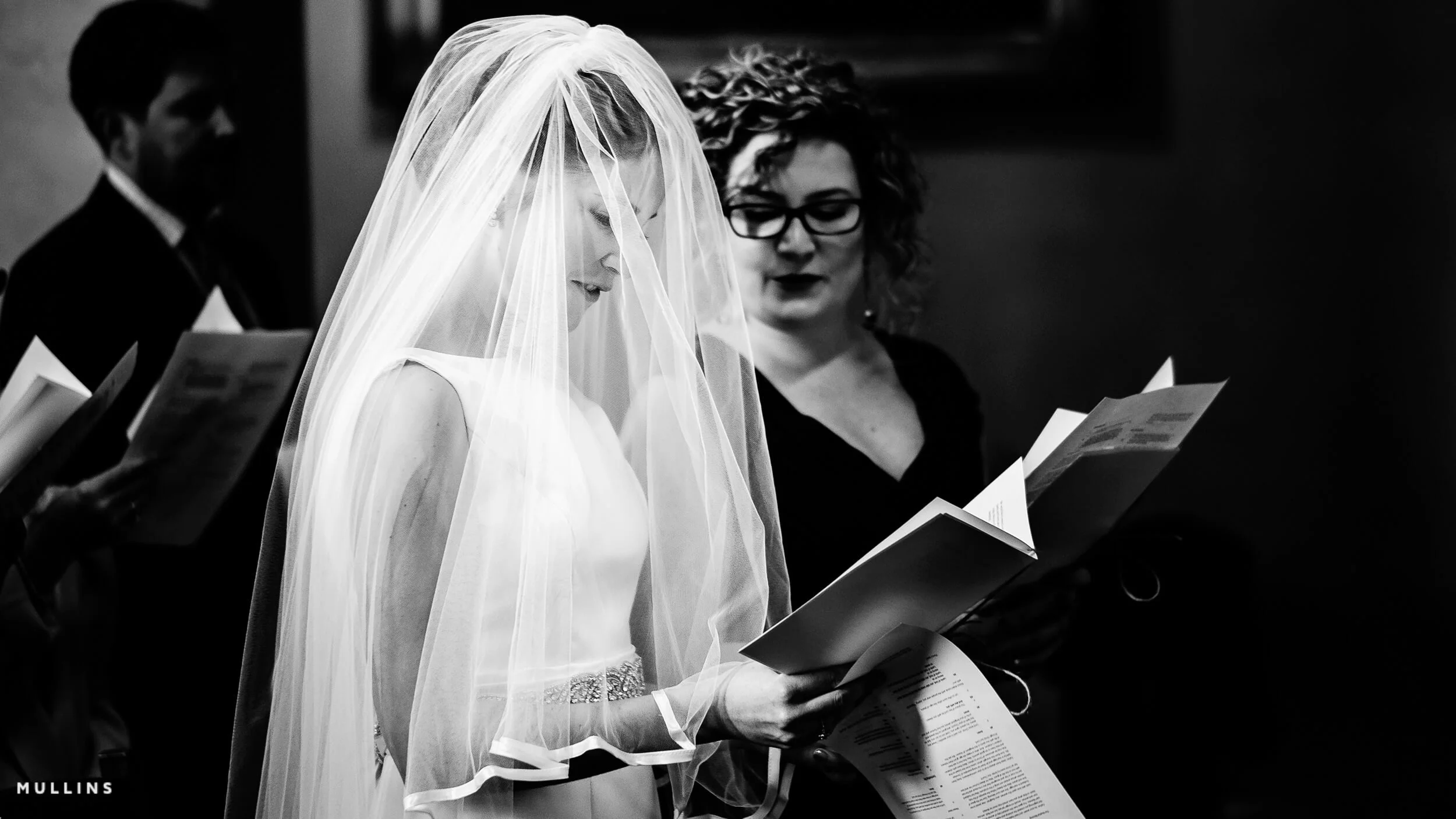 Bride in a church with light falling on her