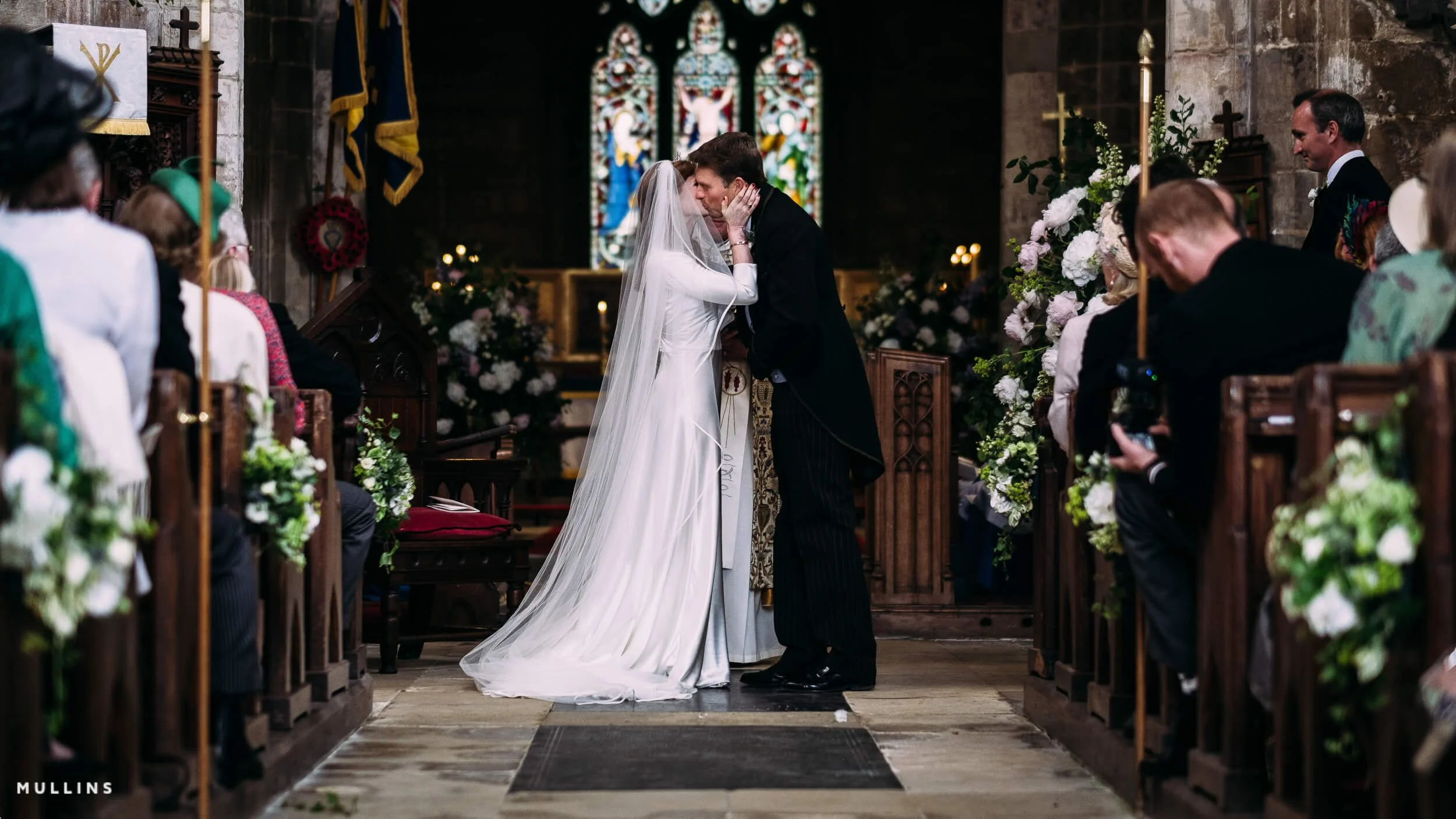 Bride and groom first kiss