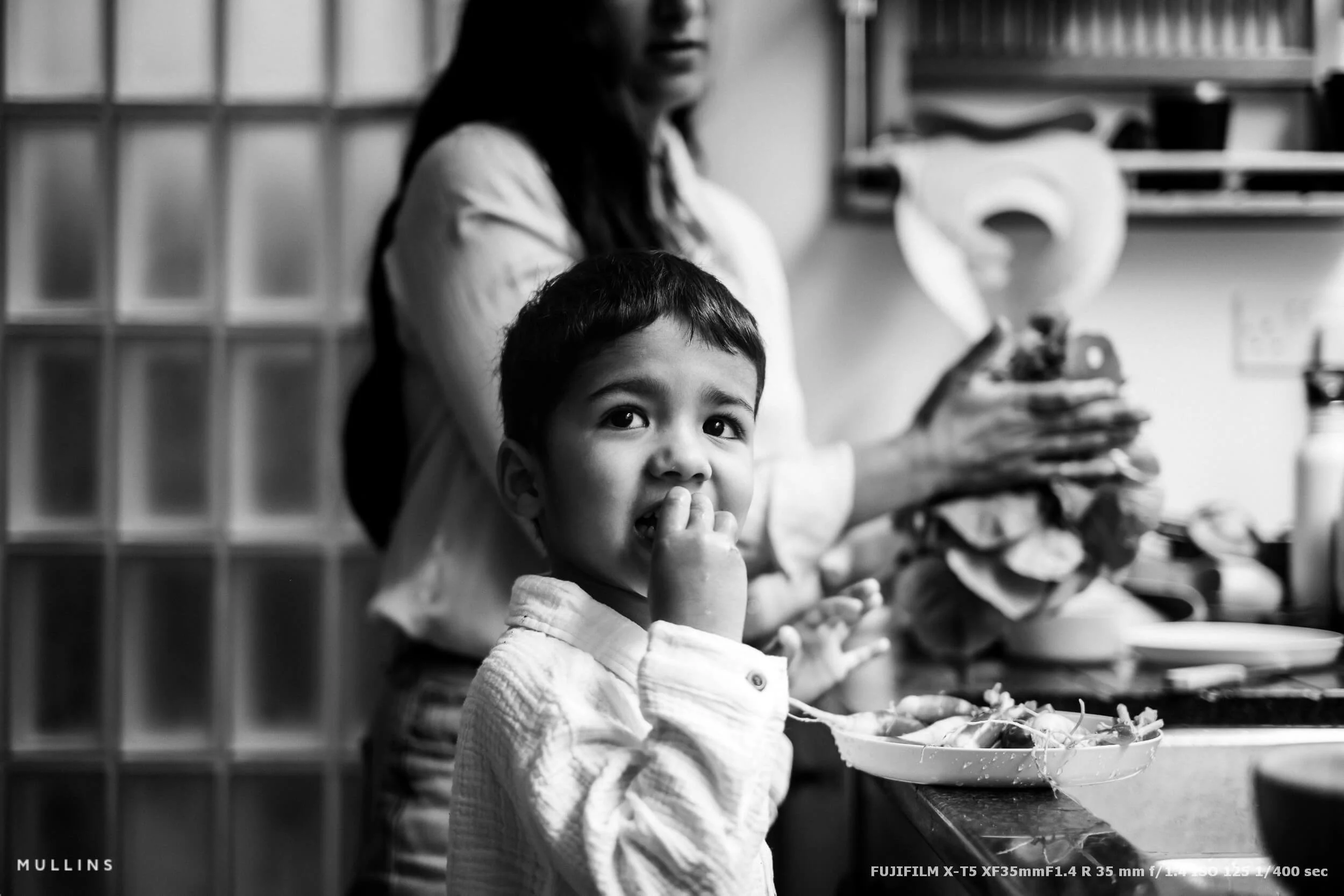 A Little boy in a kitchen.
