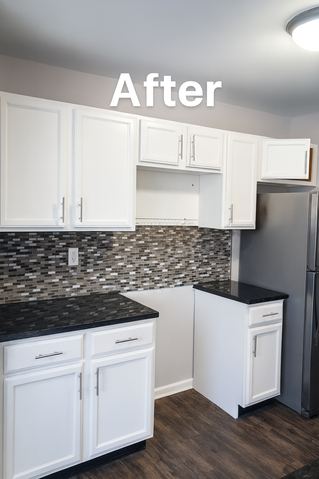 Updated kitchen with white cabinets, dark granite countertops, mosaic tile backsplash, stainless steel refrigerator, and a ceiling light fixture.