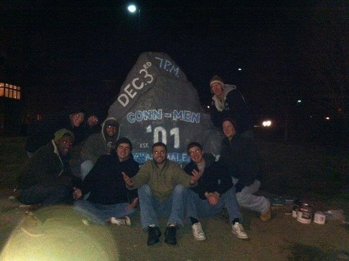 Conn-Men painting the infamous campus-rock for concert promotion