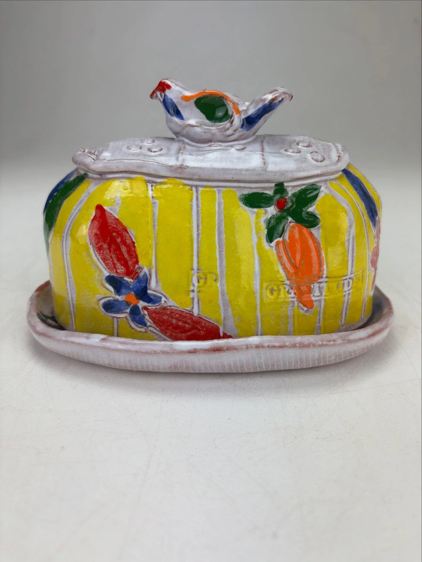 Mug Shot Monday is all about Butter! 
This Yellow Earthenware Butter dish is not playing it small in any way, shape, or color! She is fully equipped with a bird handle involving a highly evolved technique my friend @yve.ceramics called &lsquo;thumb w