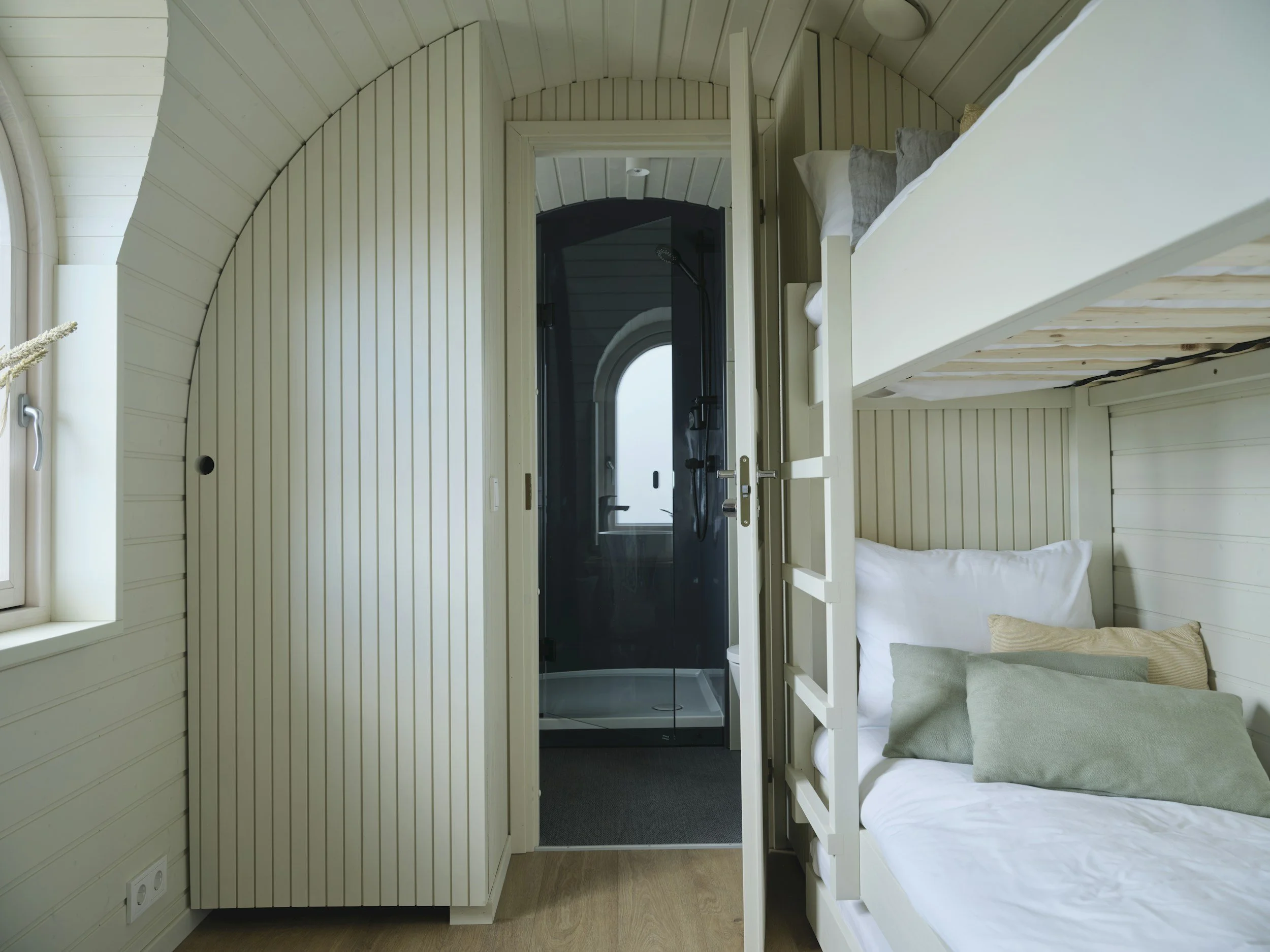 tiny house with white shiplap and built in bunk beds