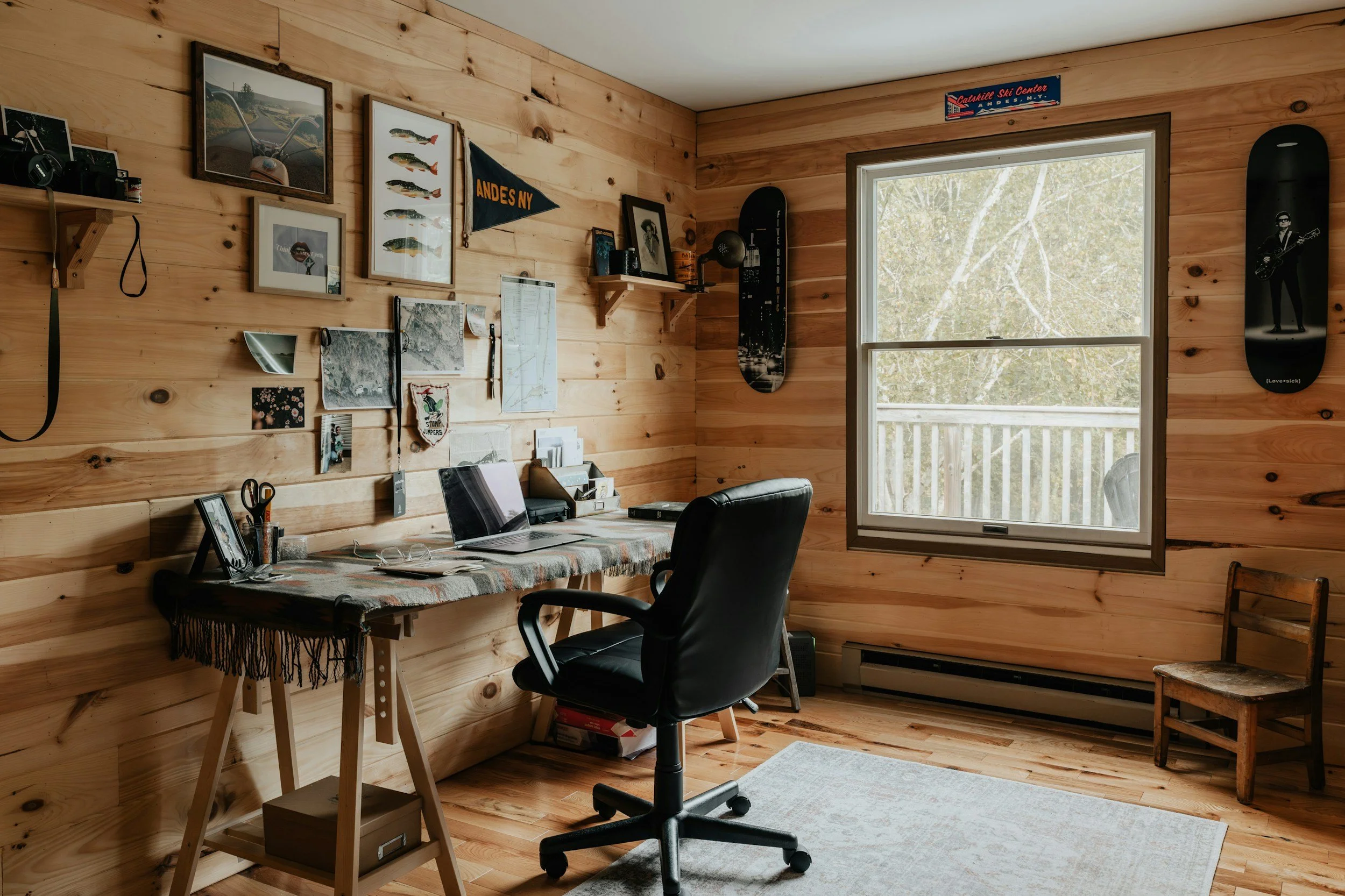 cabin office space with wood paneled walls