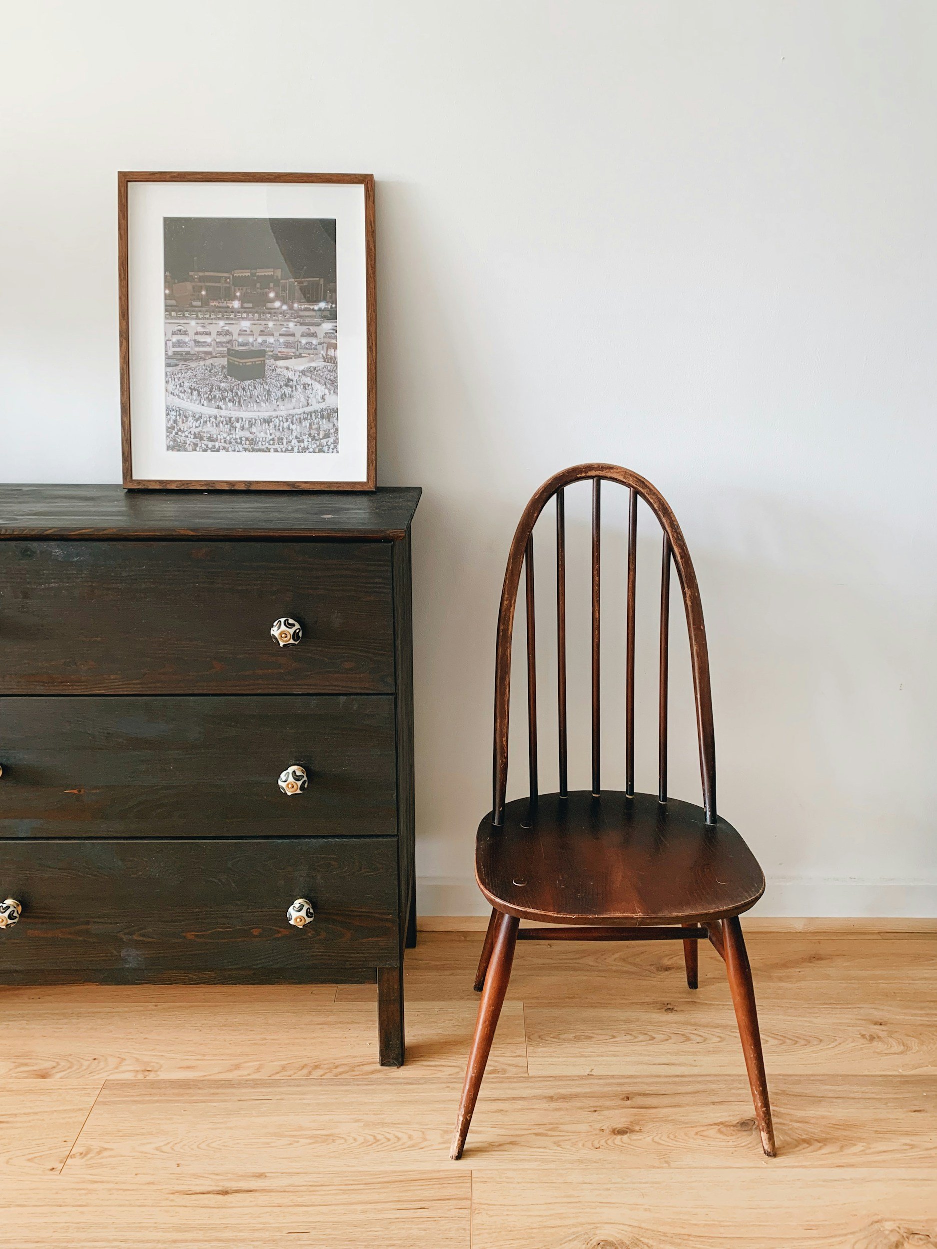 vintage chair and dresser with framed photograph