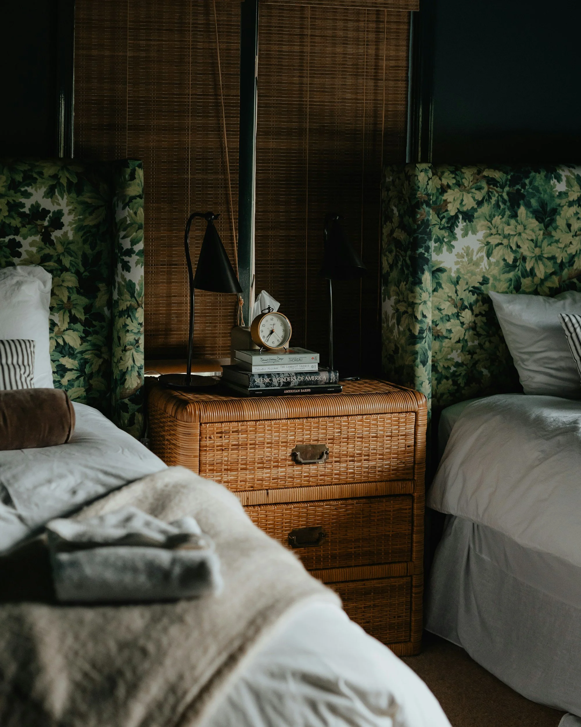 moody bedroom with floral headboards