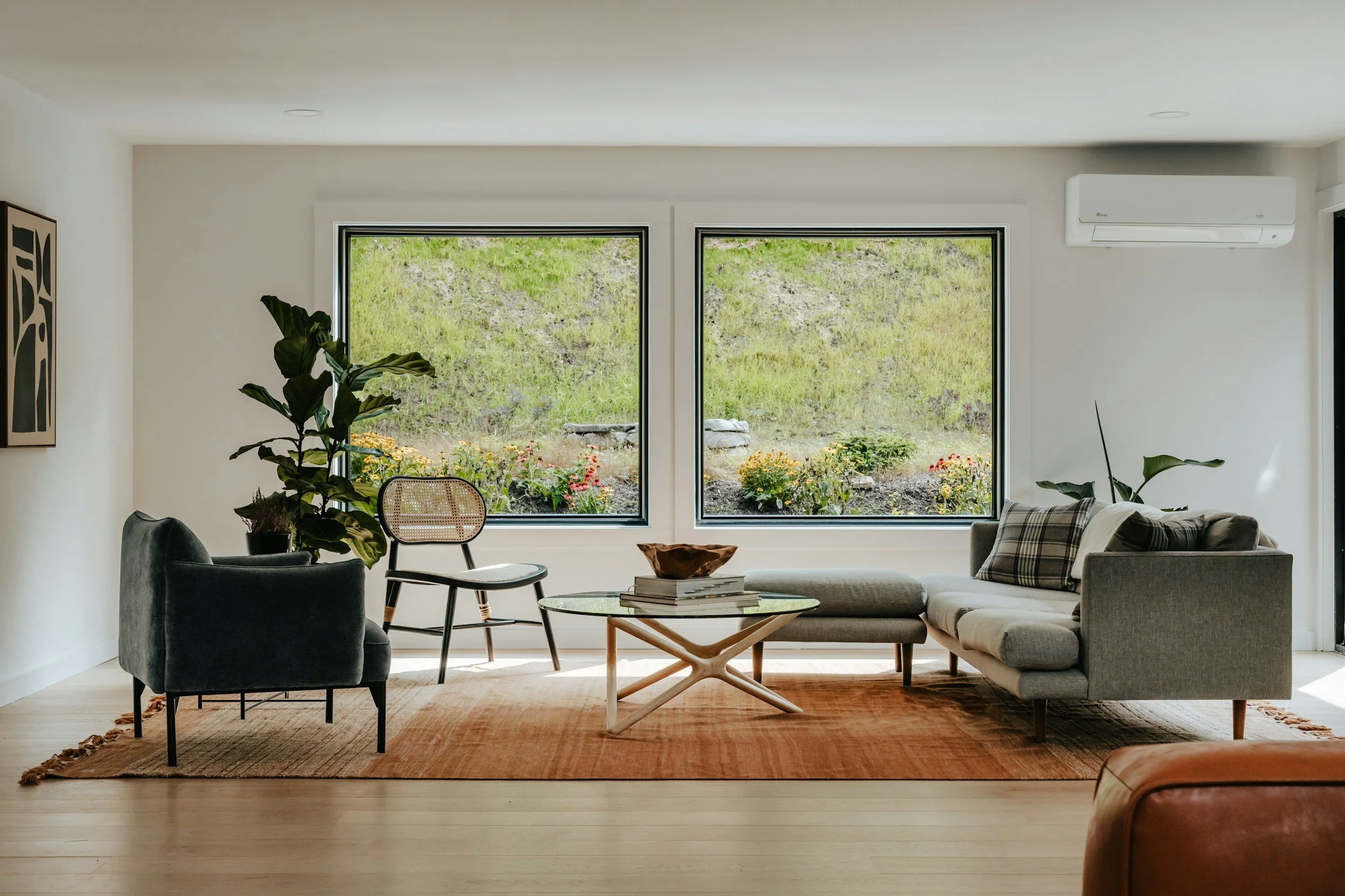 modern living room with white walls and orange rug