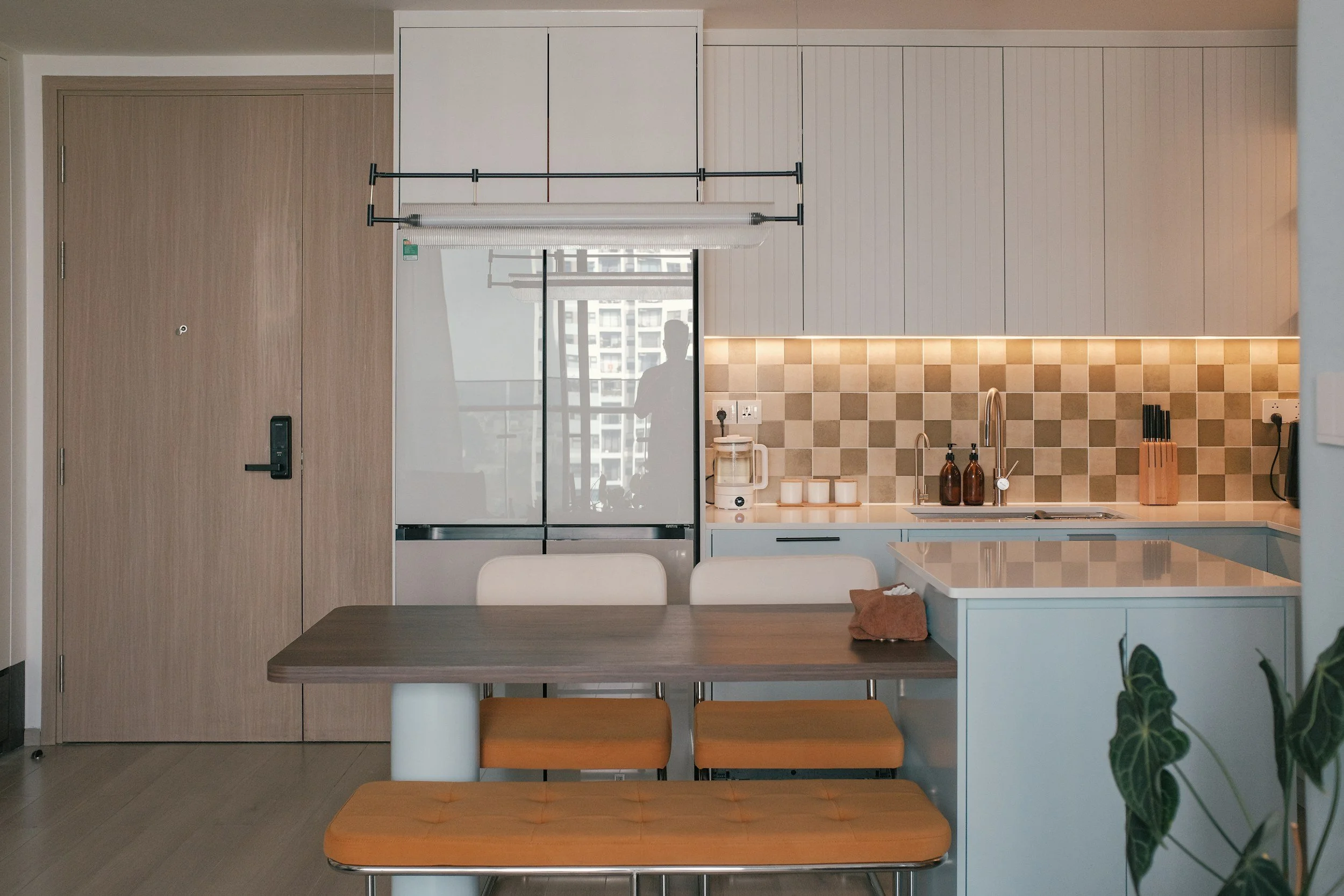 modern minimal kitchen with neutral checkerboard backsplash