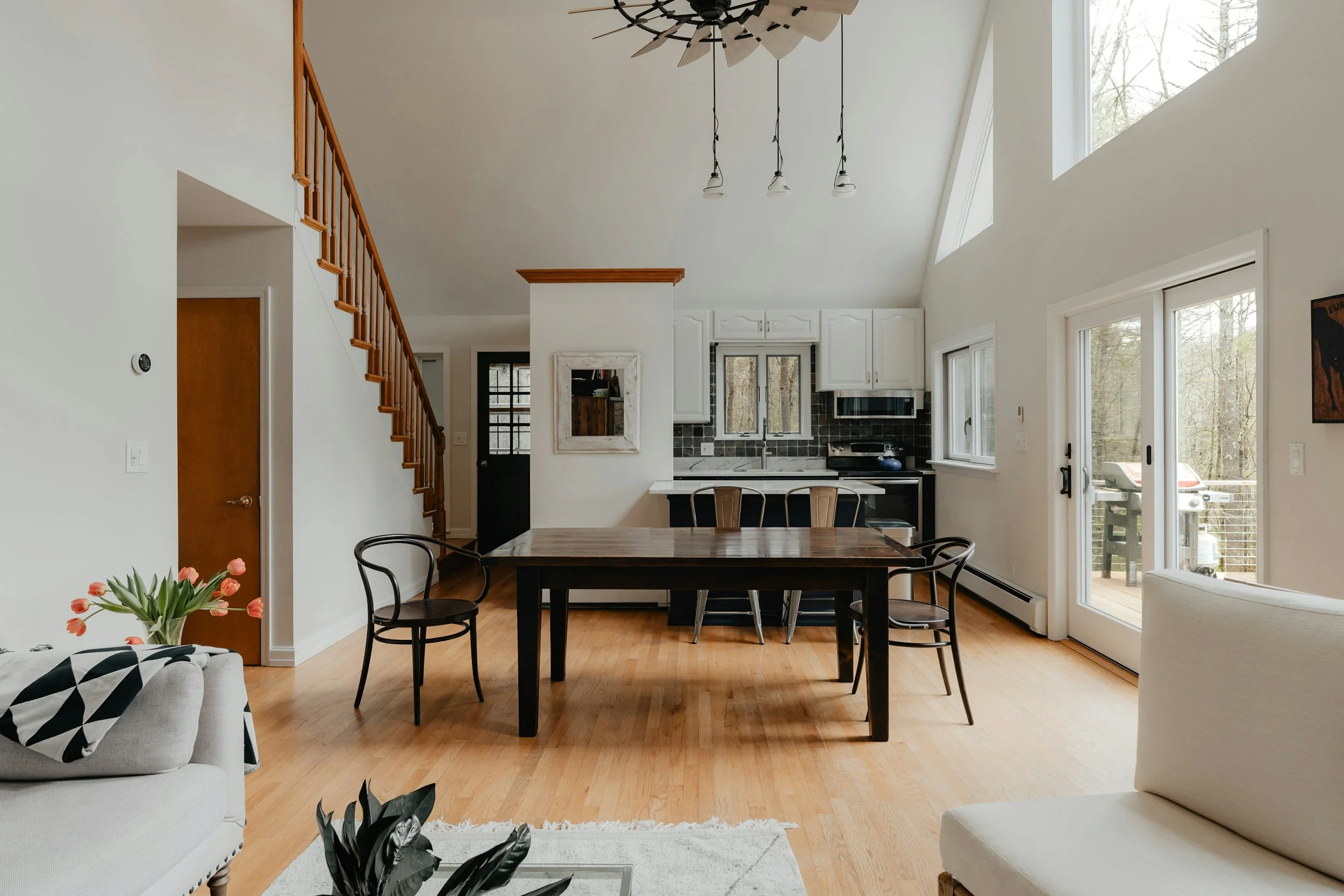open concept dining living room with a black dining table