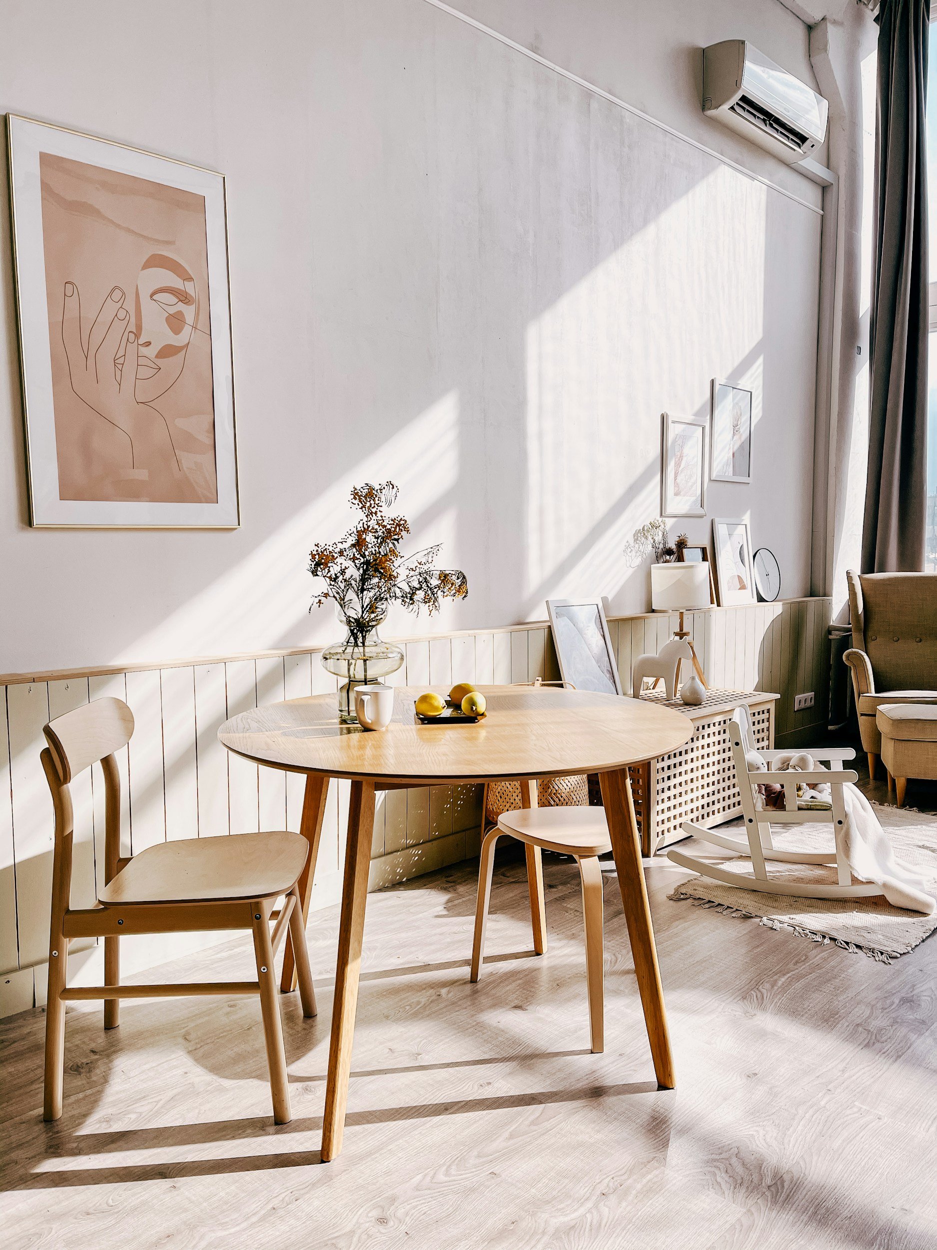bright minimalist boho interior with white rocking chair