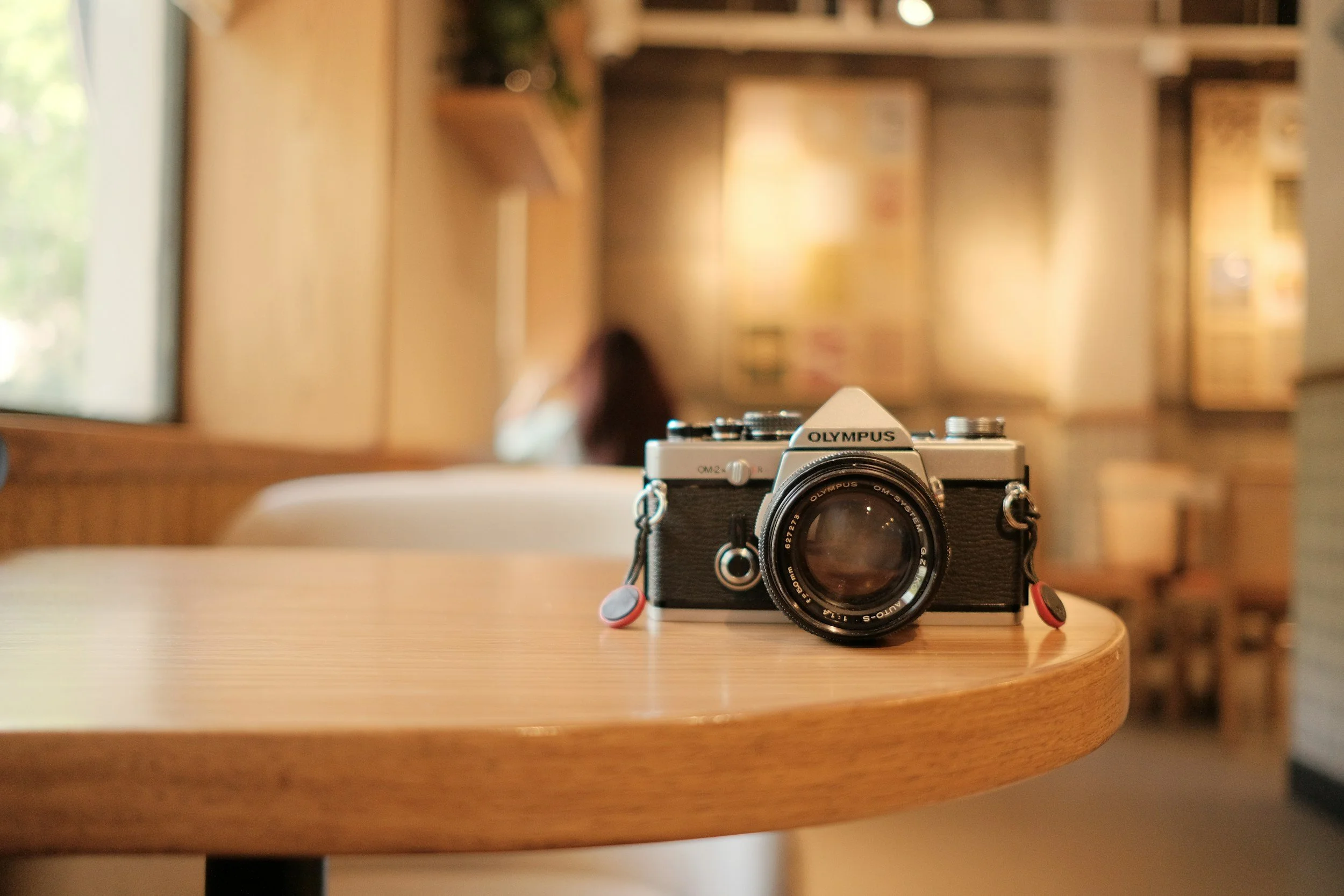 camera on round wood table