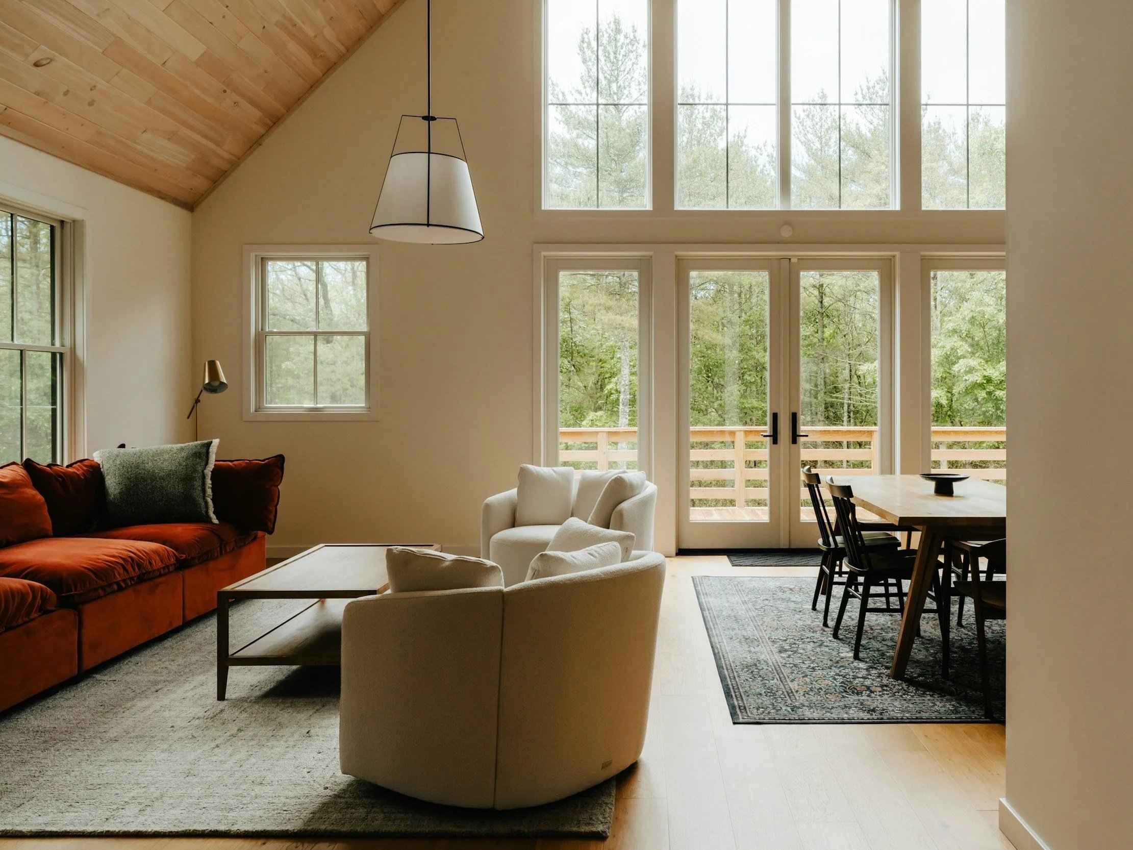 red sofa with wood ceiling and white walls